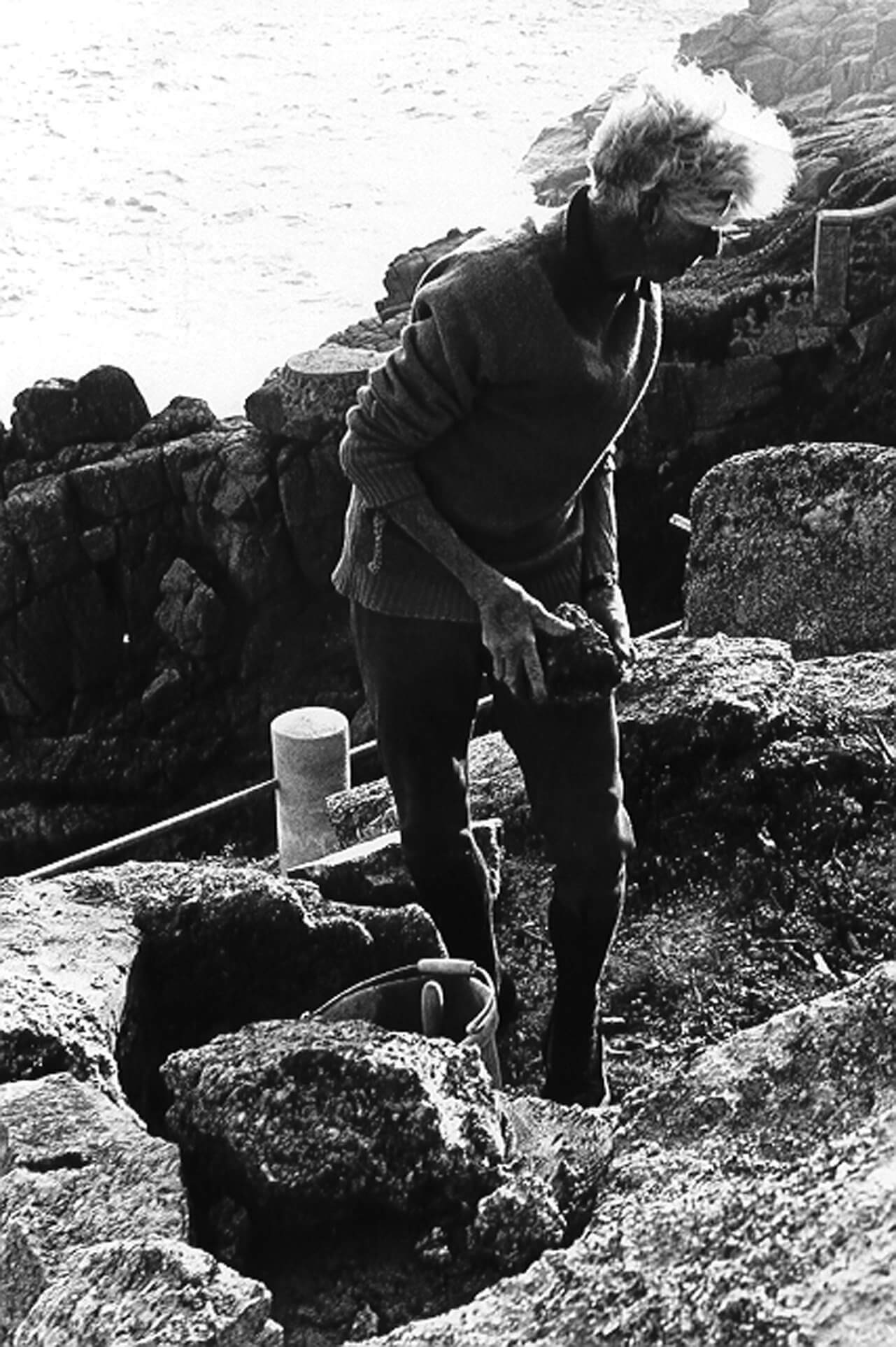Rowena Cade building the Gully Seats on the rocks