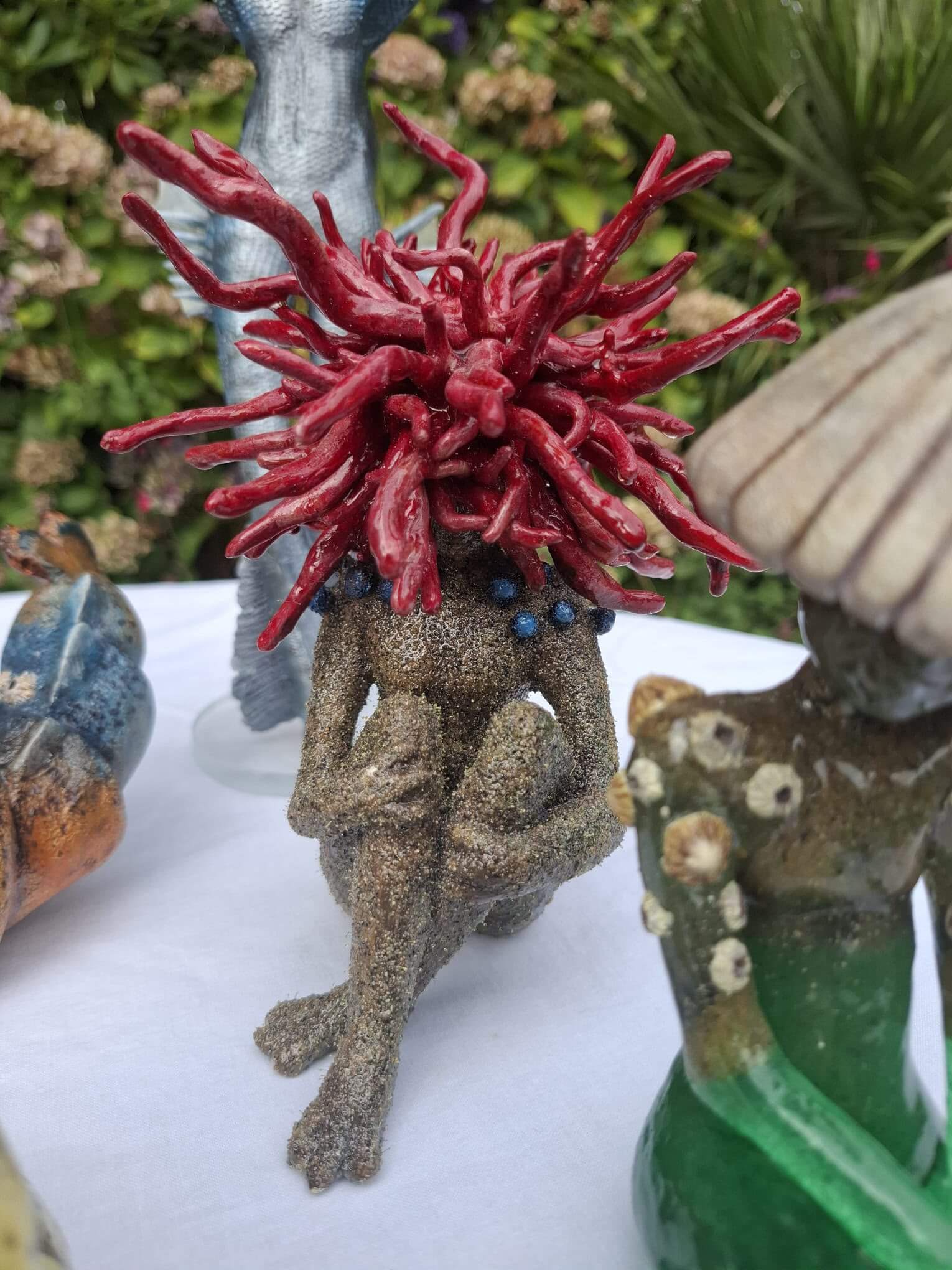 Sea-fae sculptures on a table