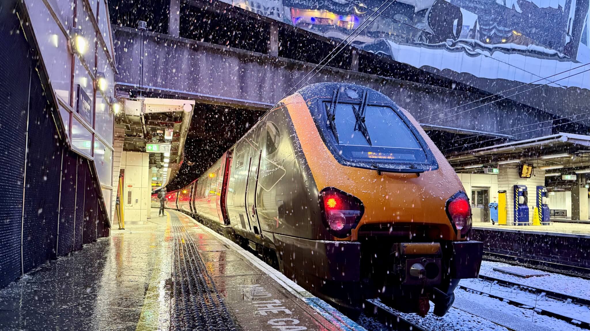 CrossCountry train at a snowy Birmingham New Street platform
