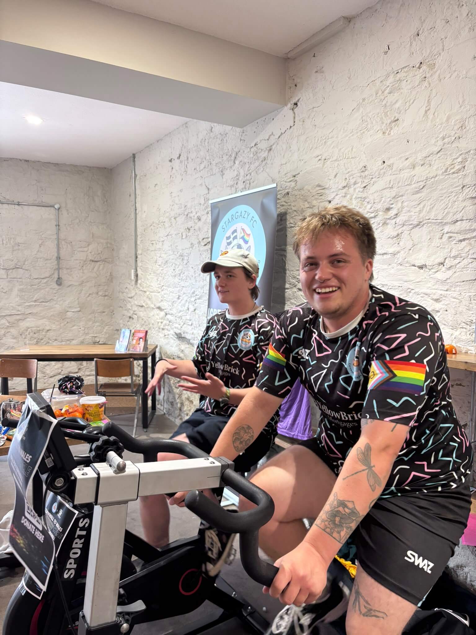 Stargazy FC player smiling on an exercise bike