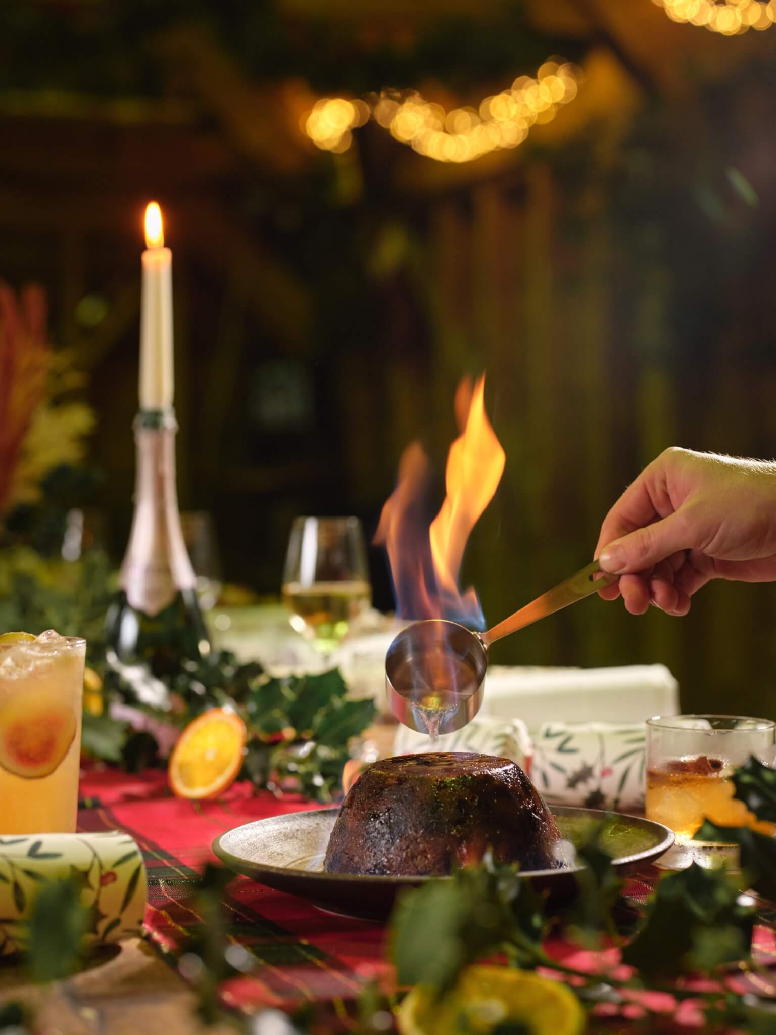 Christmas pudding being flambéed at the table