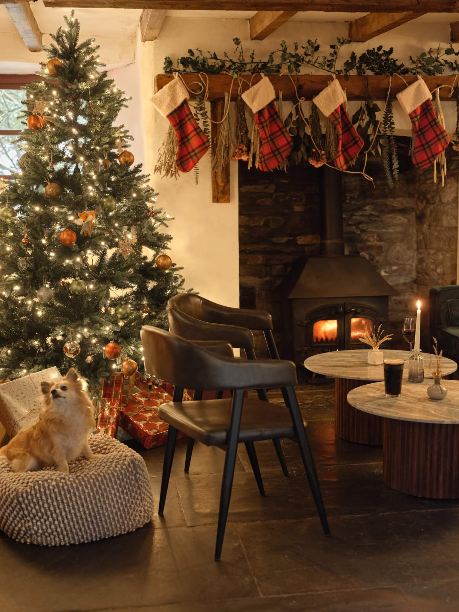 Pub interior with Christmas tree, stockings and log burner
