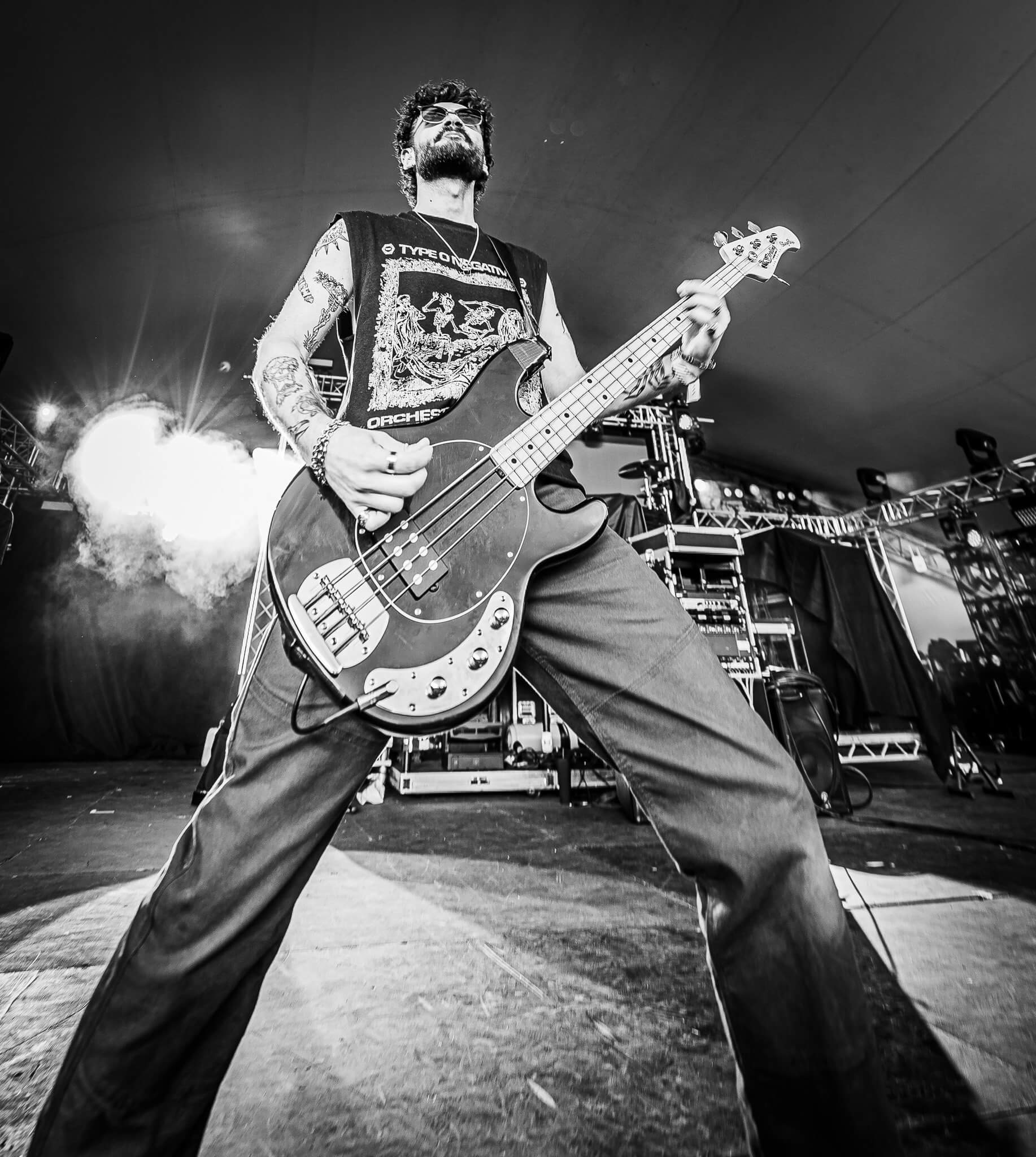 Black and white photo of a bass player on stage at The Great Estate Festival 2026