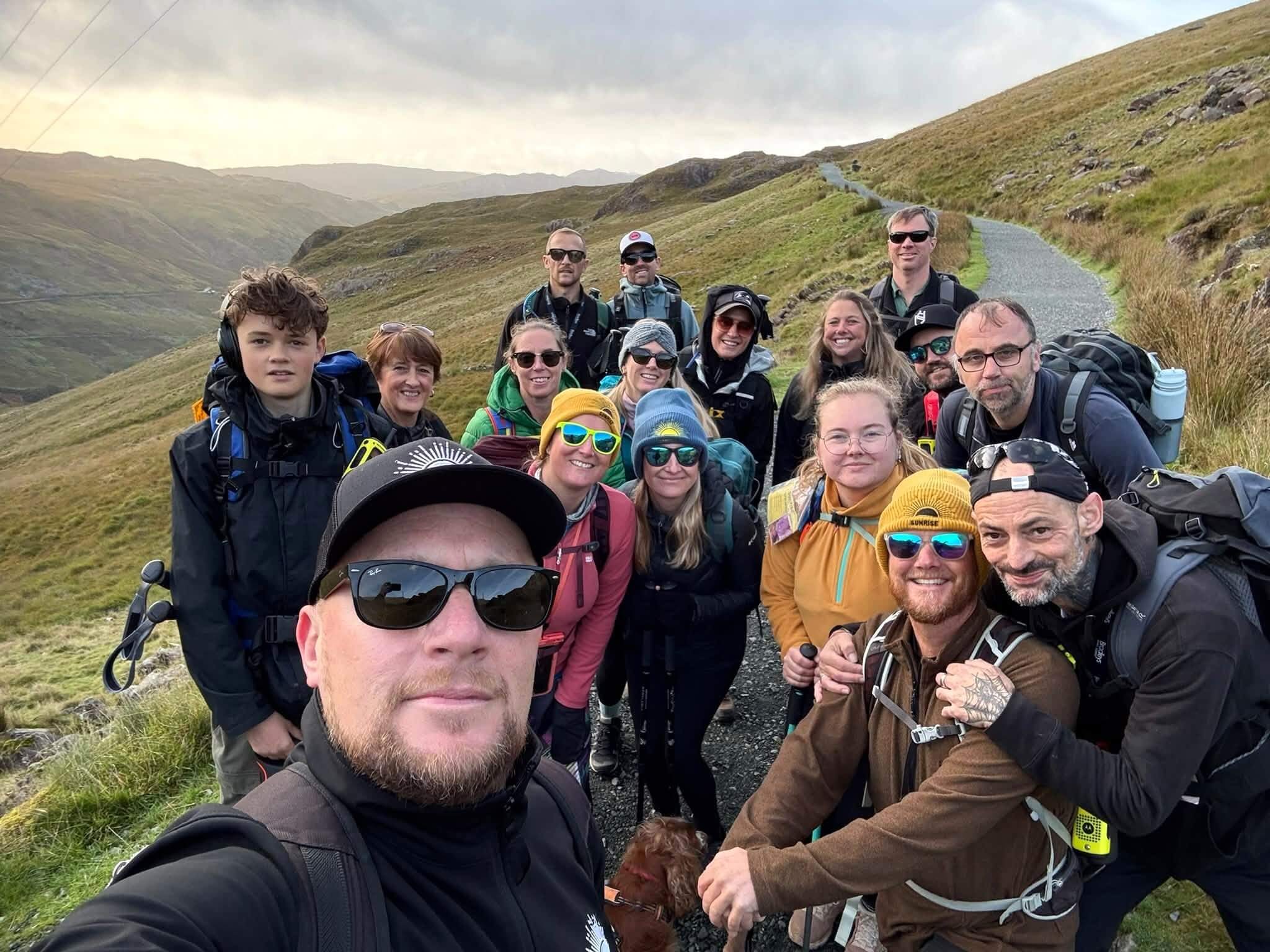 Sunrise Cornwall CIC Three Peaks team selfie on a mountain path