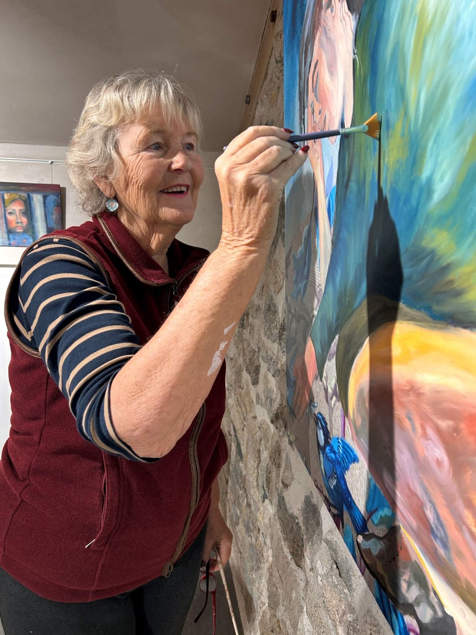 Terrye Teverson adding the finishing touches to a painting