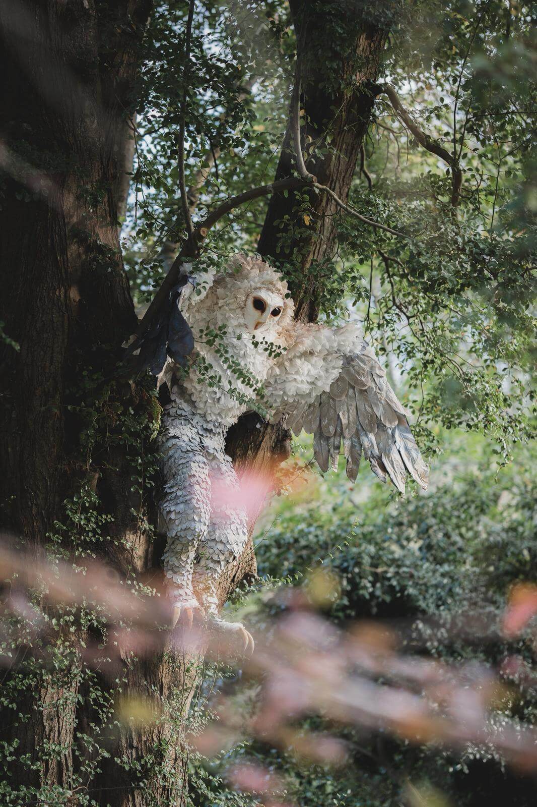 Owlman of Mawnan sculpture in the trees at Trelissick