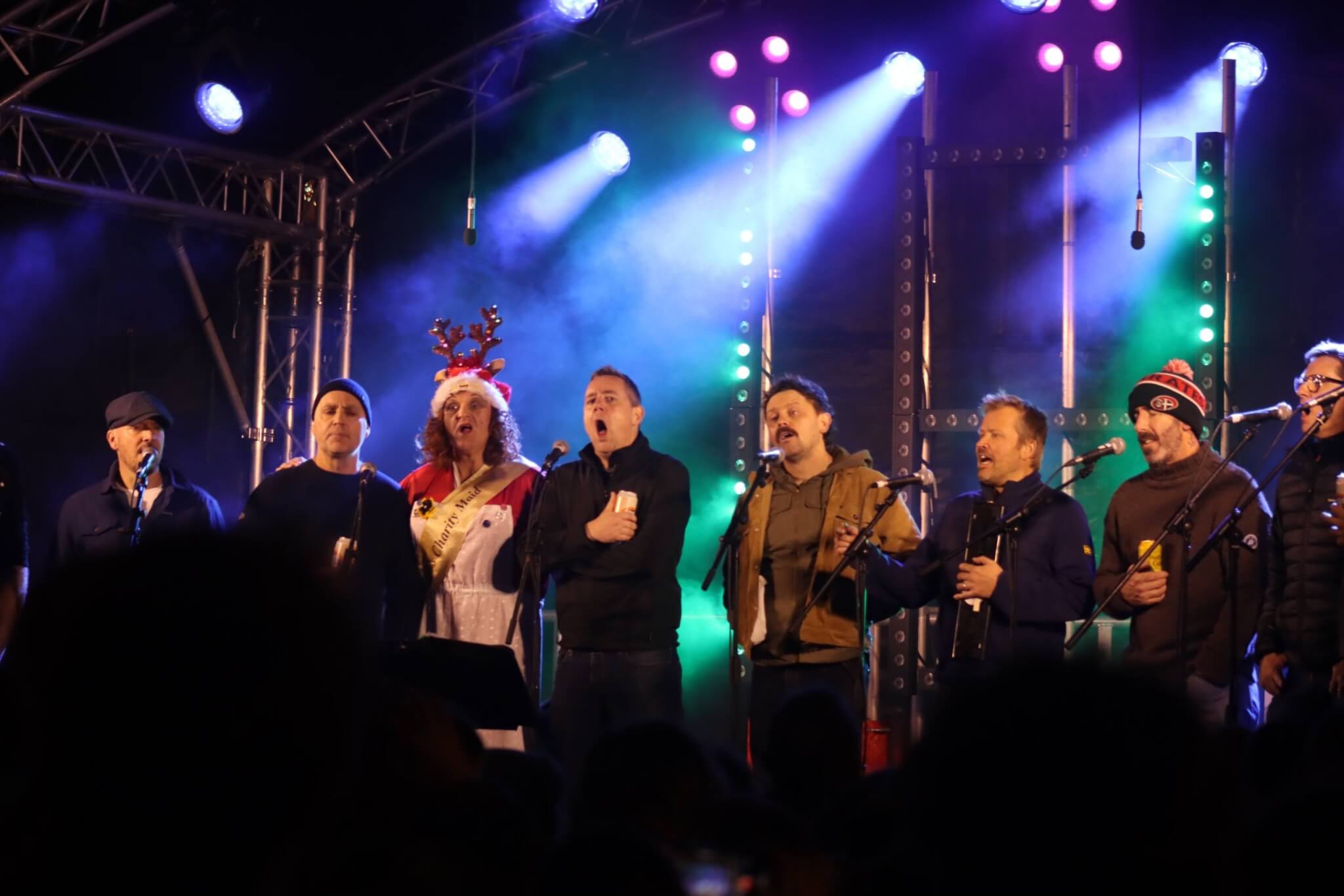 The Oggymen singing on stage at the Falmouth Christmas switch-on