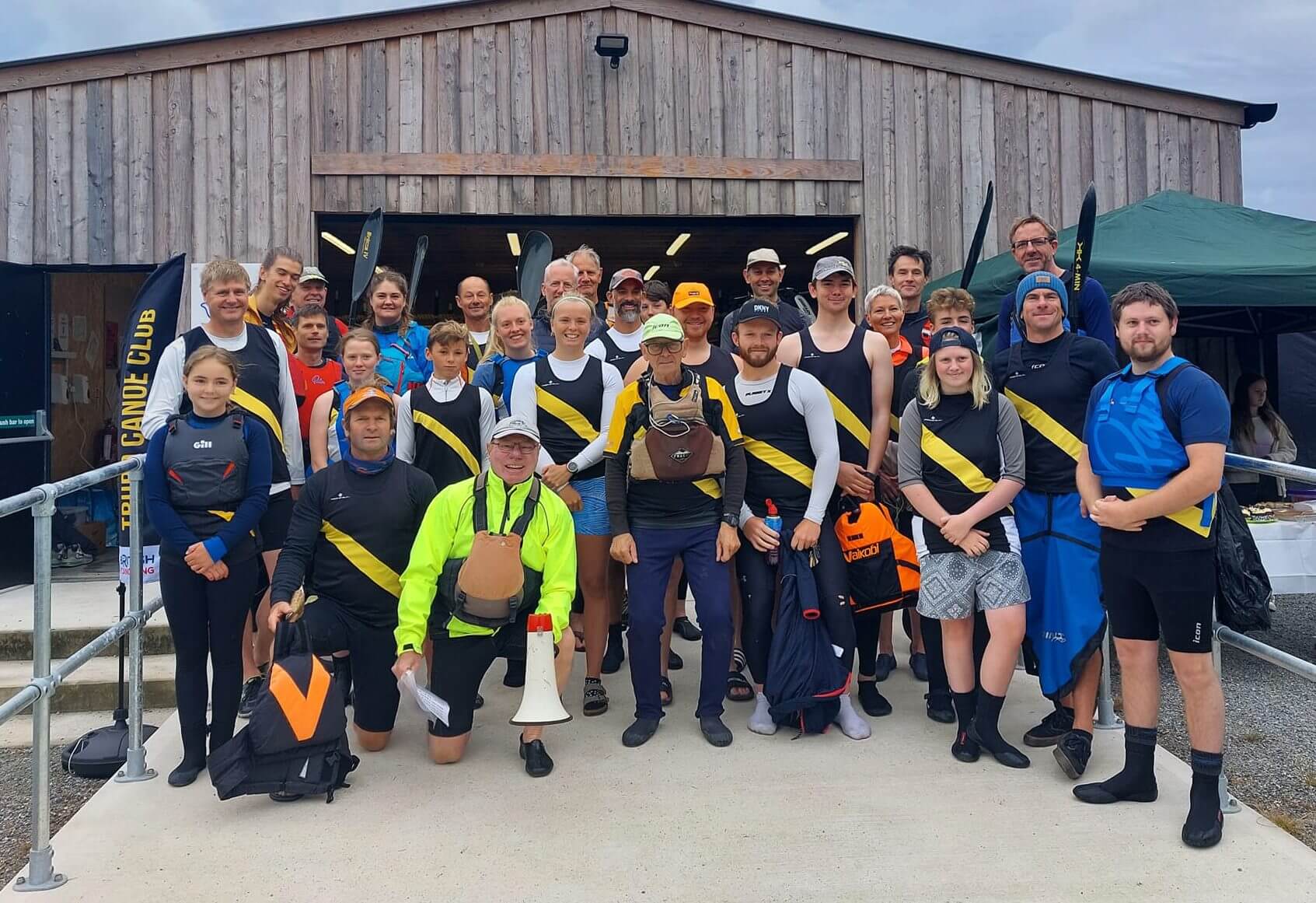 Truro Canoe Racing Club members outside the club house at Boscawen Park