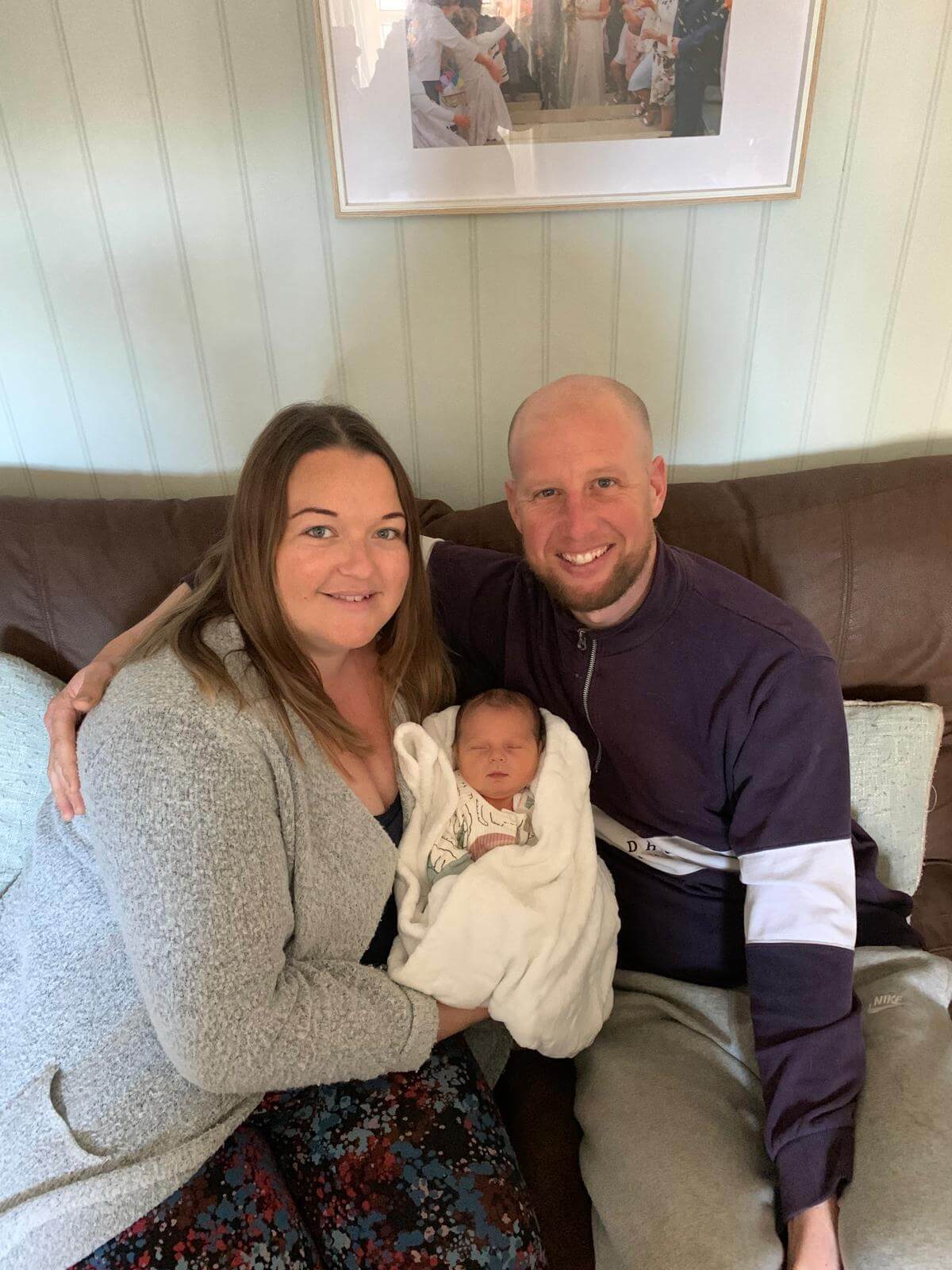 Sarah Doolin and Craig Pollard with their newborn son Ezrah at home