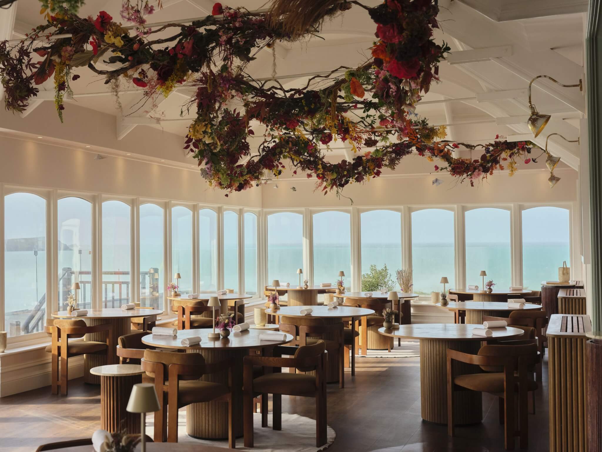 Ugly Butterfly restaurant dining room decorated for Christmas with sea views over Fistral