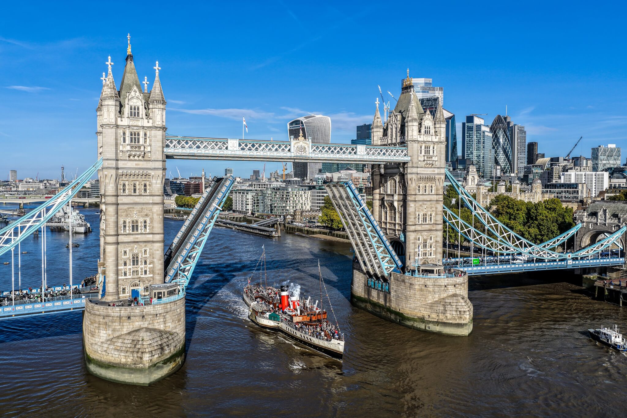 Aerial view of Waverley passing through the open Tower Bridge