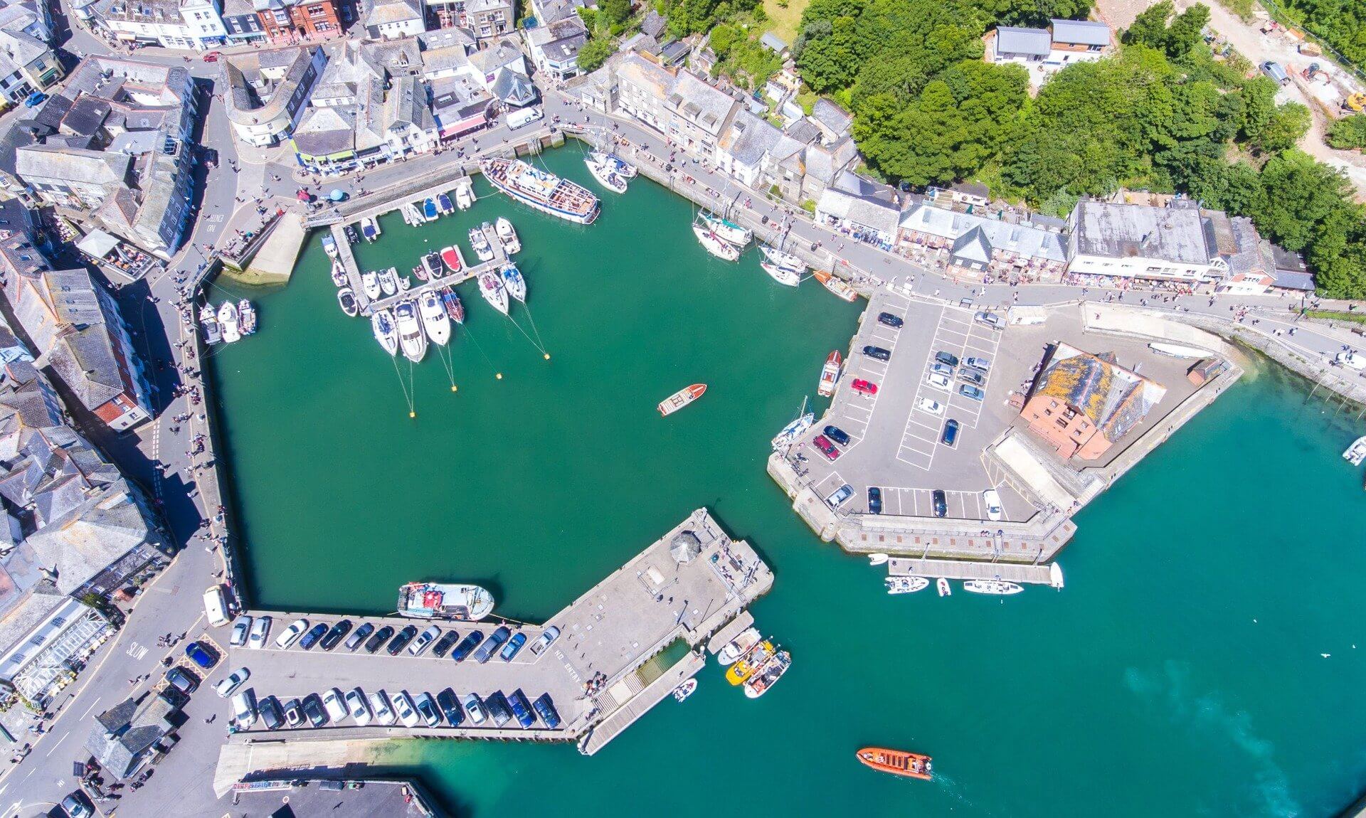 Aerial view of Padstow harbour with boats and quayside shops