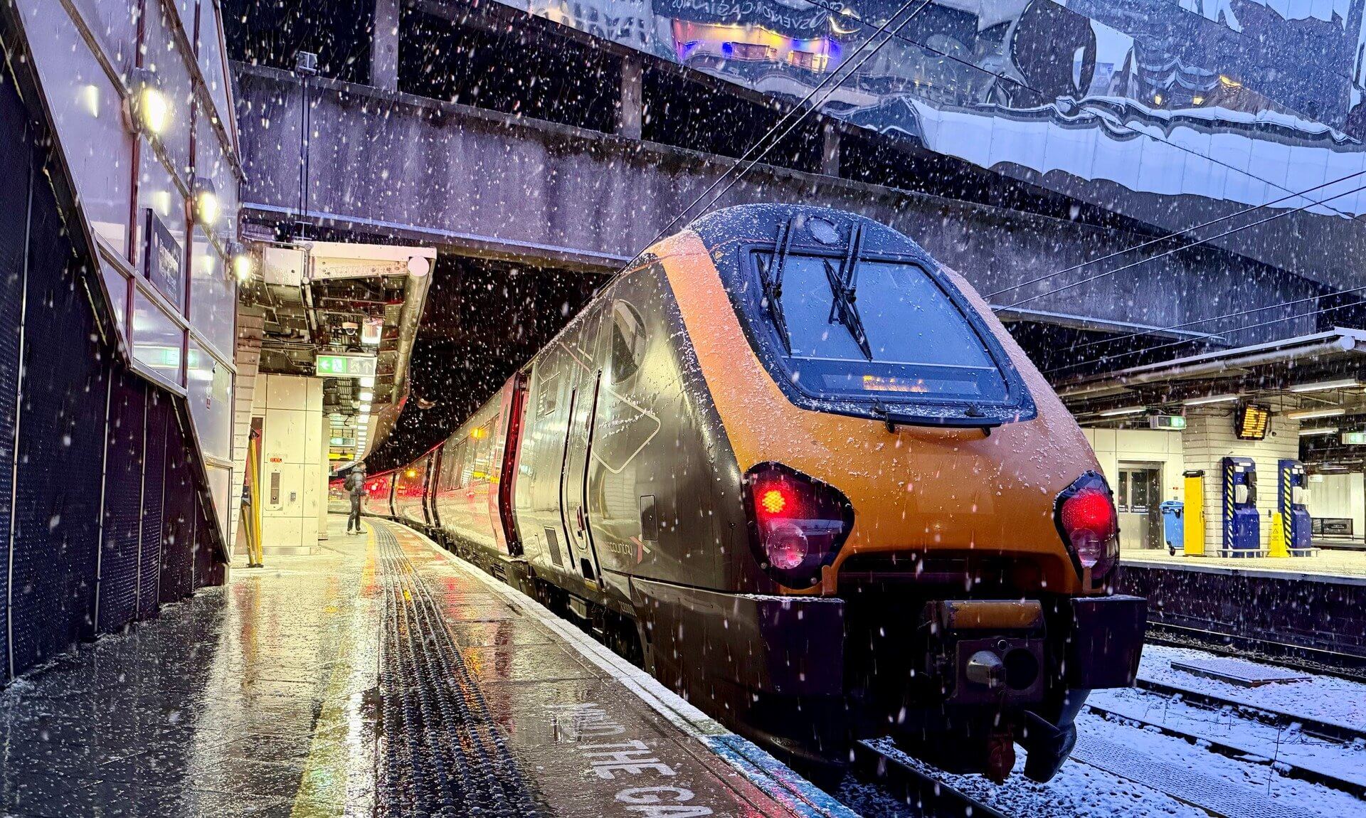 CrossCountry train at a snowy Birmingham New Street platform