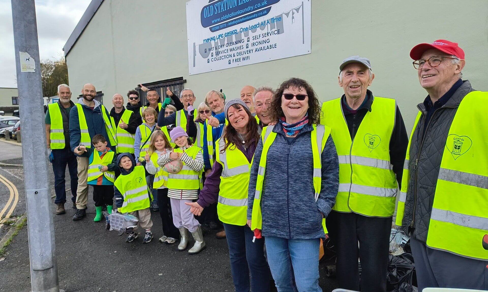 Bodmin Tidy it Team volunteers in hi-vis vests giving a thumbs up