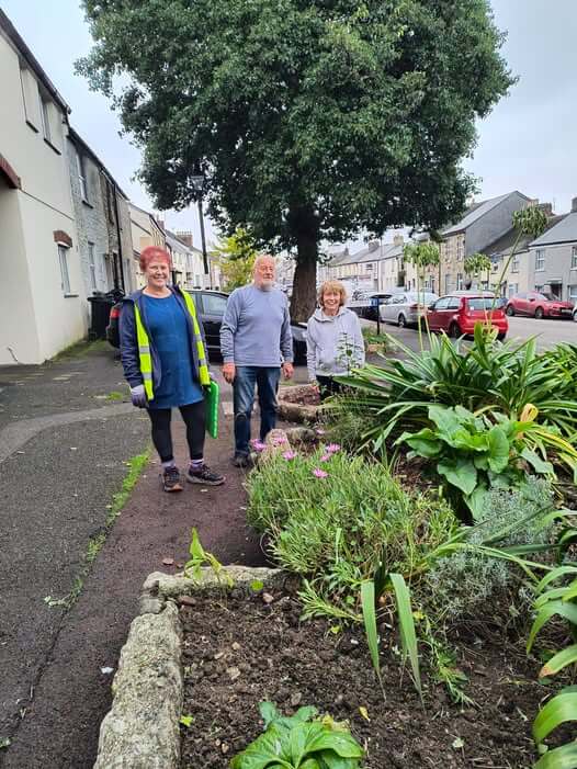 Bodmin Tidy it Team volunteers beside the flower beds on Higher Bore Street, Bodmin
