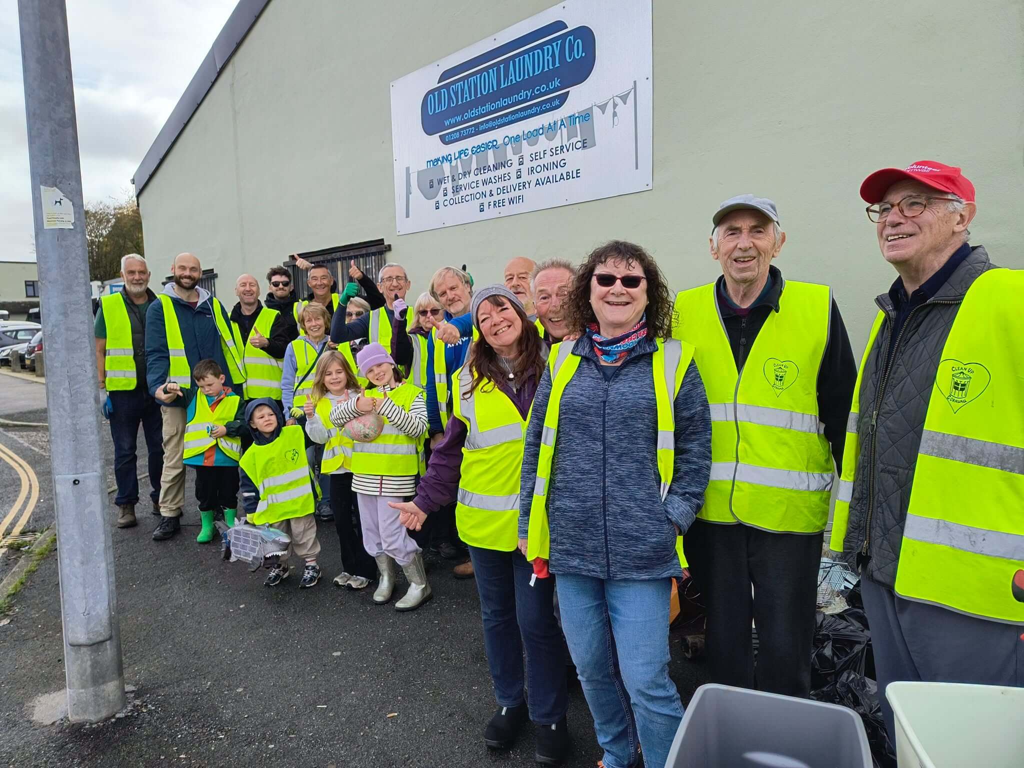 Bodmin Tidy it Team volunteers in hi-vis vests giving a thumbs up