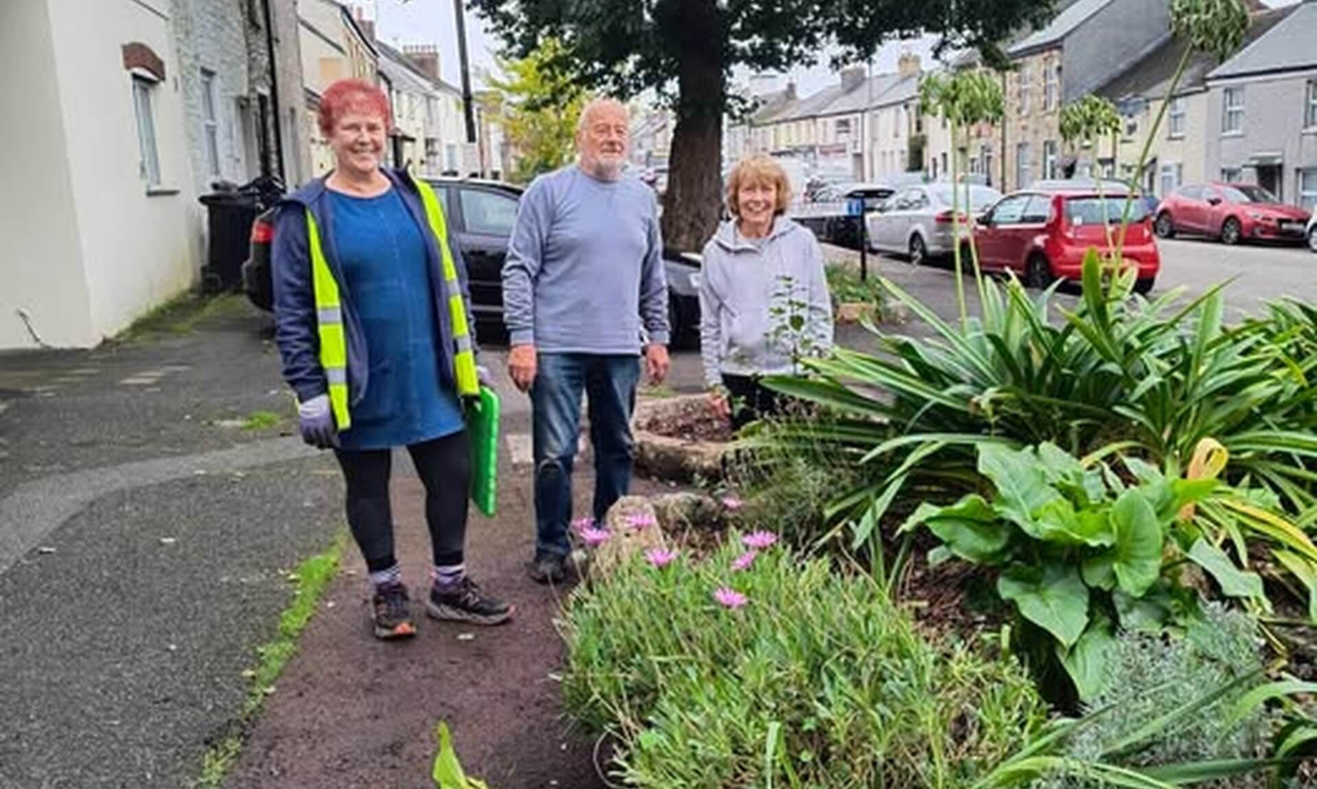 Bodmin Tidy it Team volunteers beside the flower beds on Higher Bore Street, Bodmin