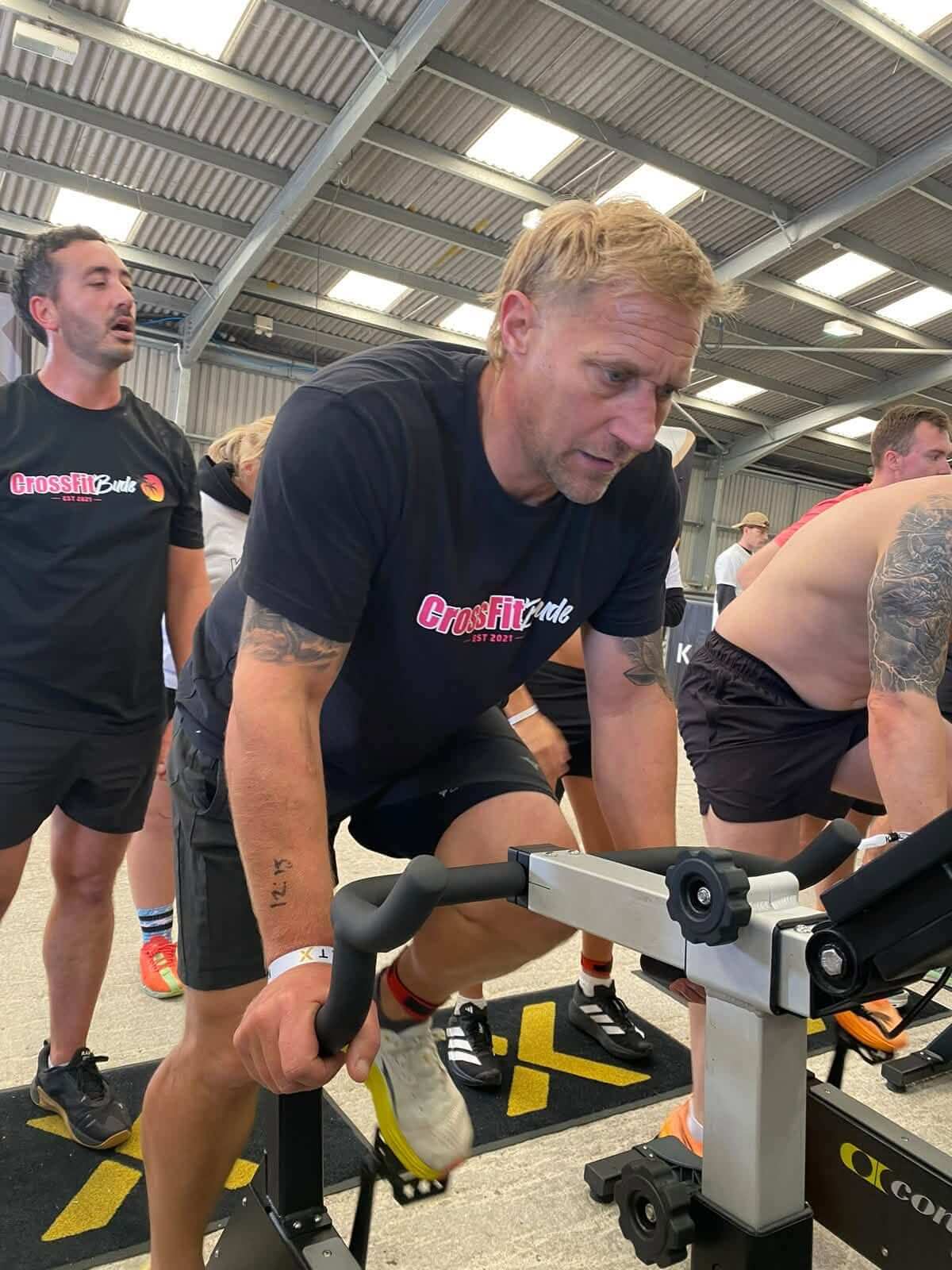 Bude lifeboat crew member on an exercise bike at KeltX