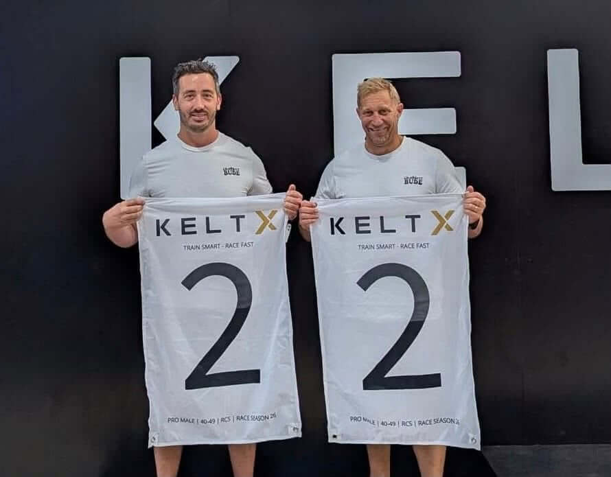Bude lifeboat crew members Liam and Paul Corthine holding KeltX second place flags