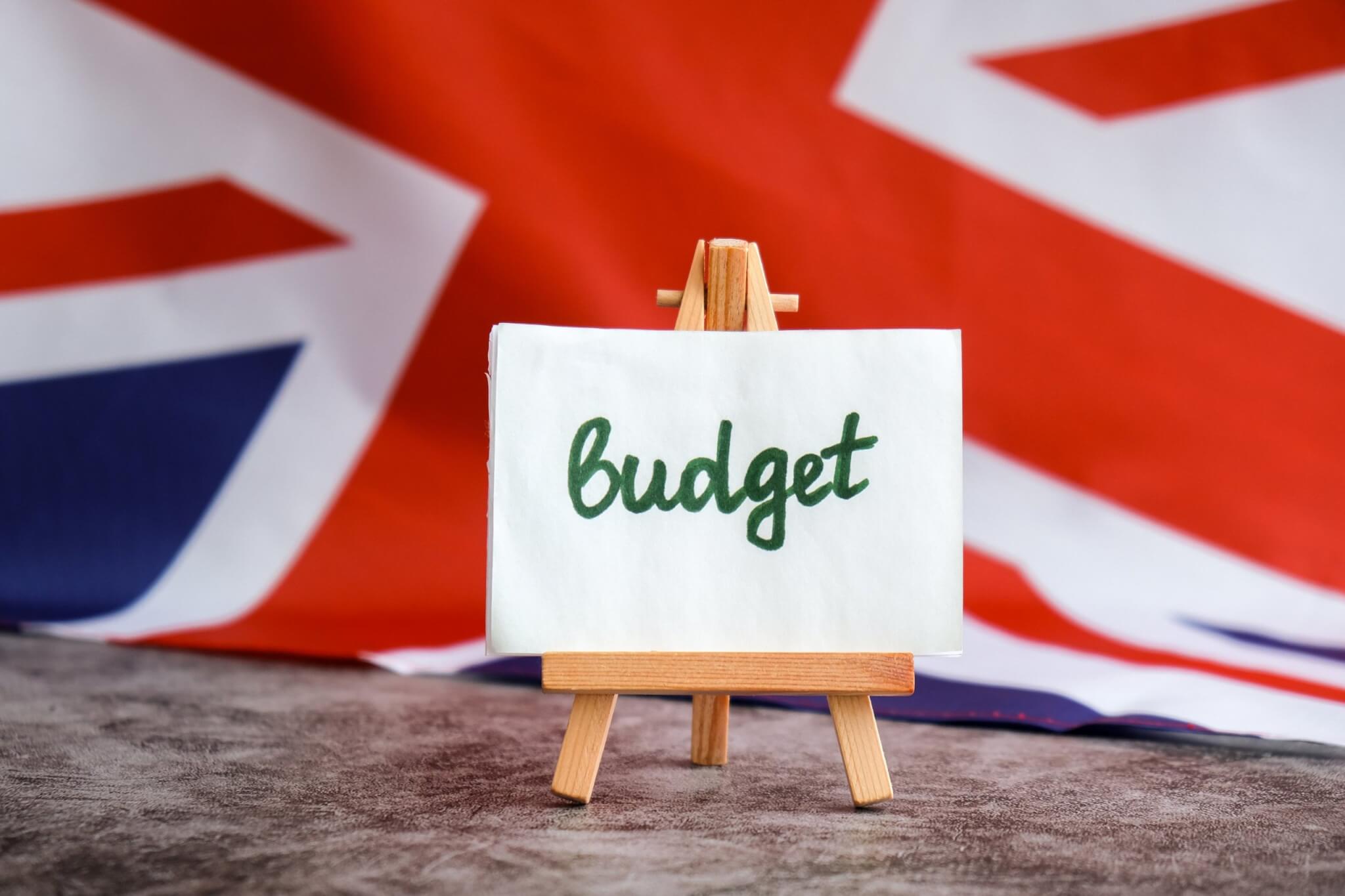 A Budget sign on a small easel in front of a Union flag