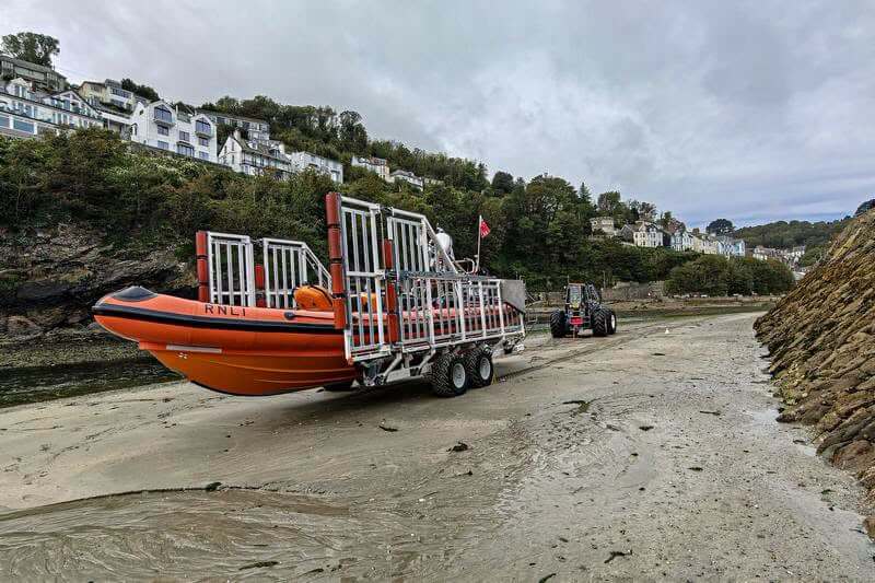 Looe RNLI Atlantic 85 lifeboat on its trailer on the river bed