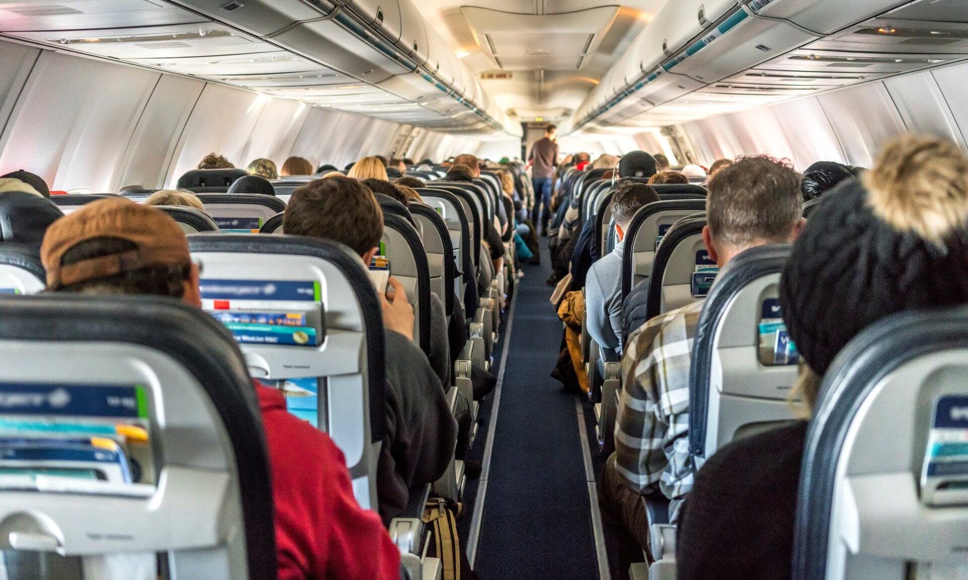 Passengers seated in an aircraft cabin
