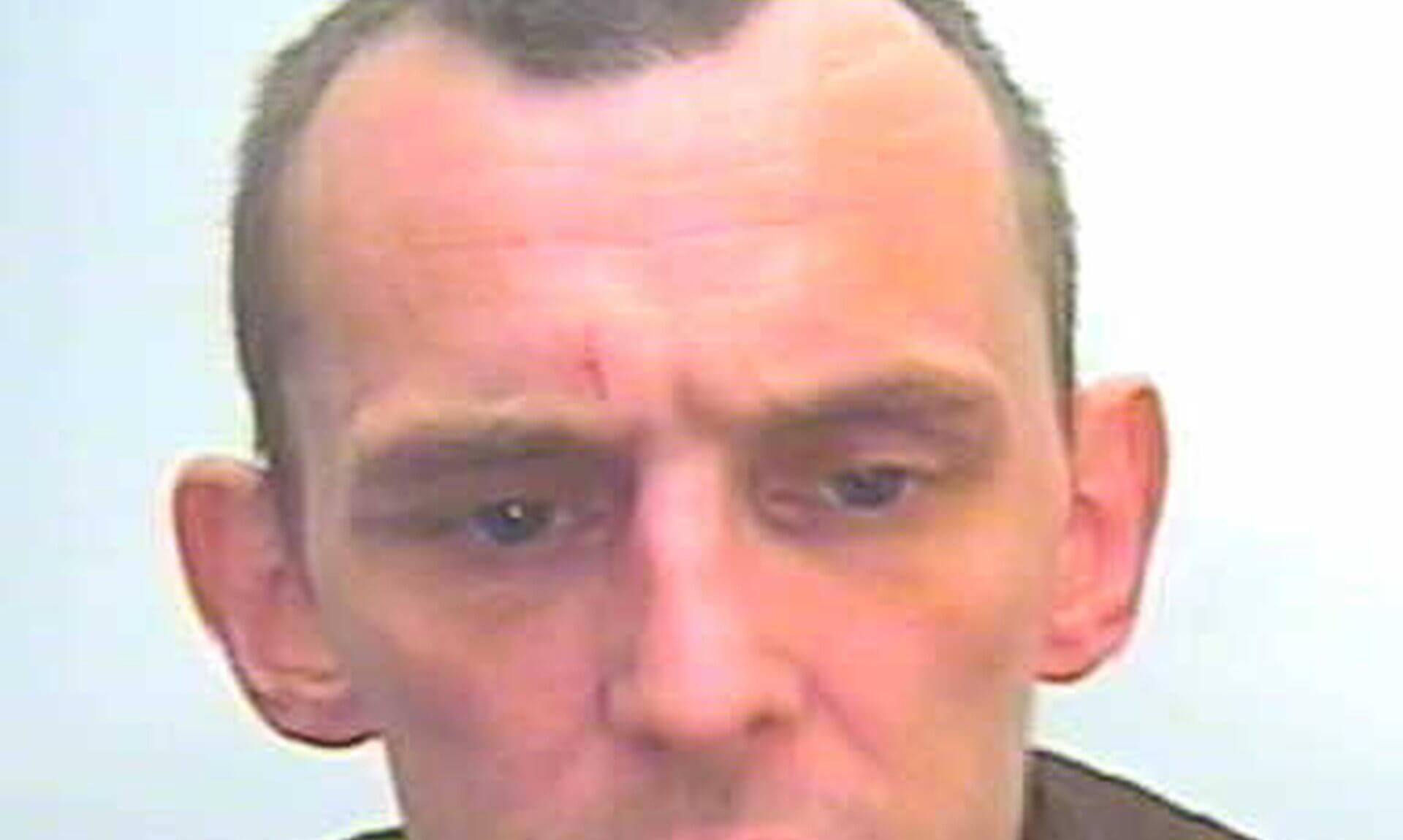 Police photo of Calvin Wood, wanted on recall to prison