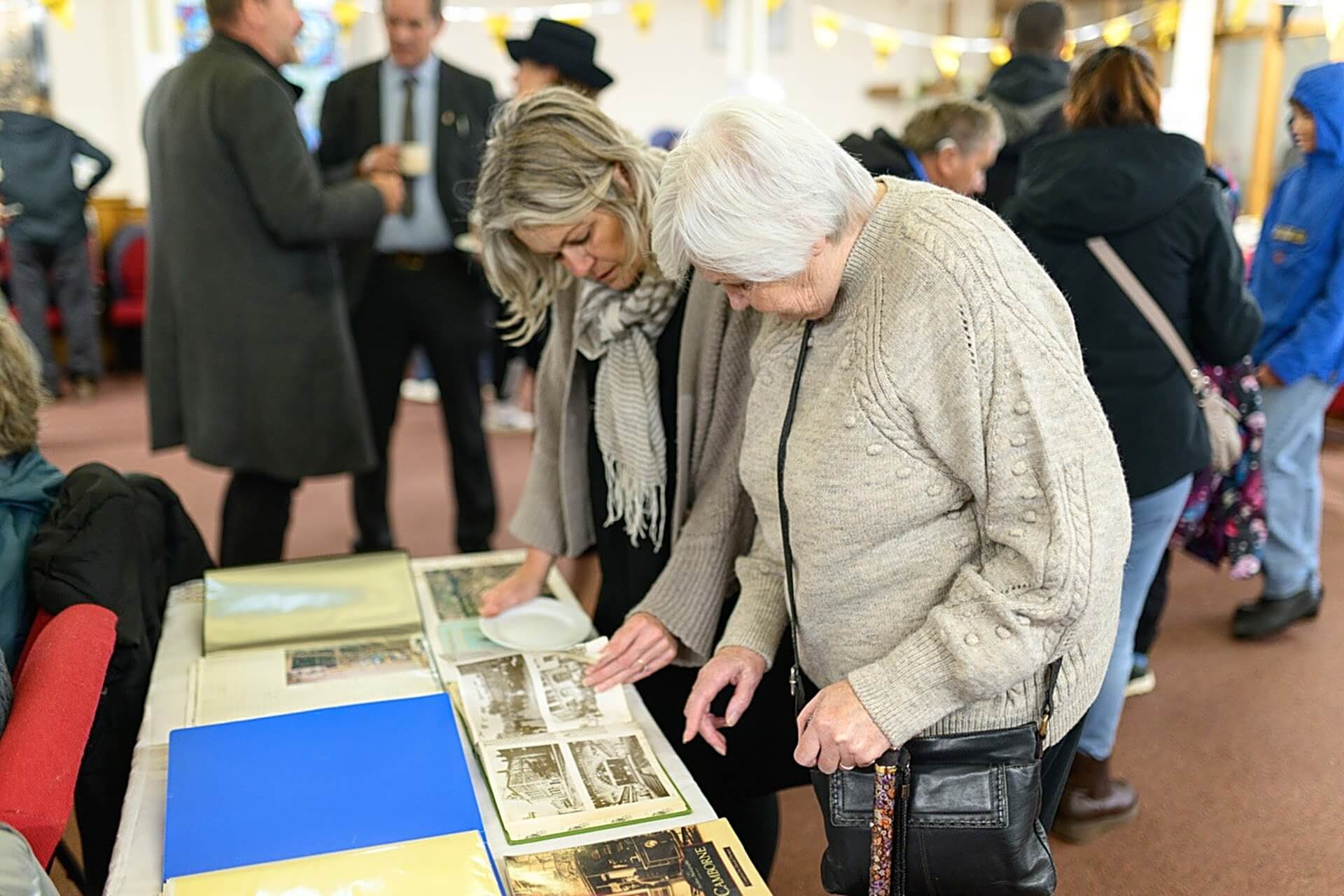 Visitors looking at archive photos of Camborne