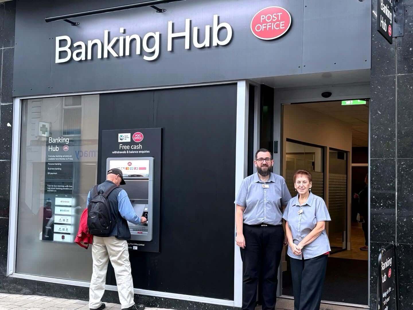 Staff outside Camborne Banking Hub on Trelowarren Street