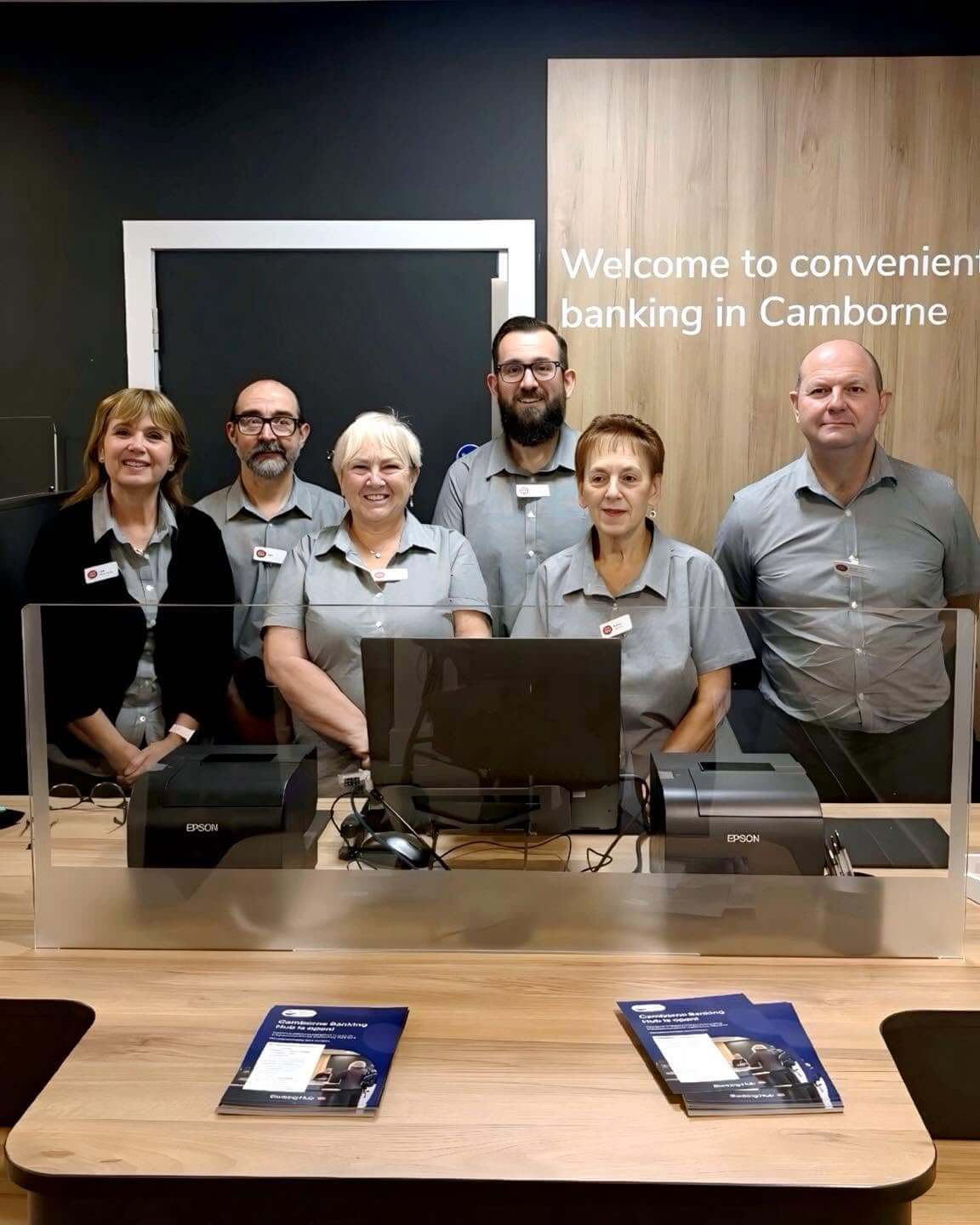 The Camborne Banking Hub team behind the counter