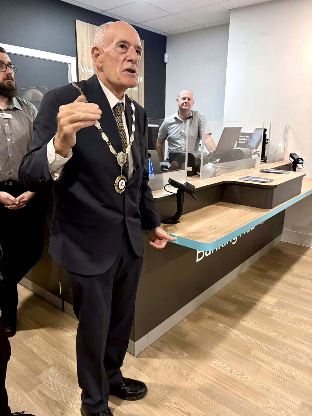 Mayor of Camborne Ed Chapman speaking at the Banking Hub counter