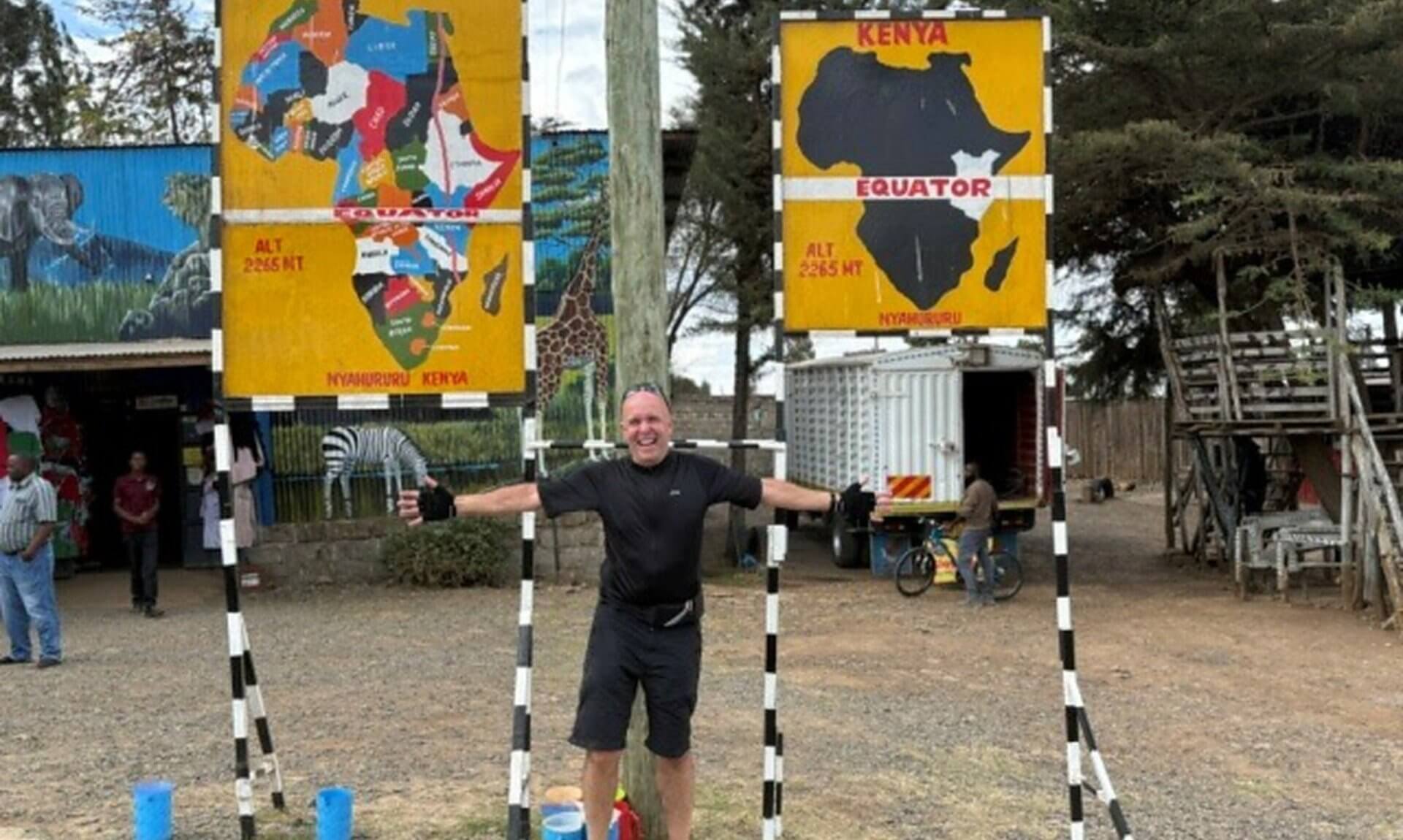 Jason Schofield at the Equator signs in Kenya