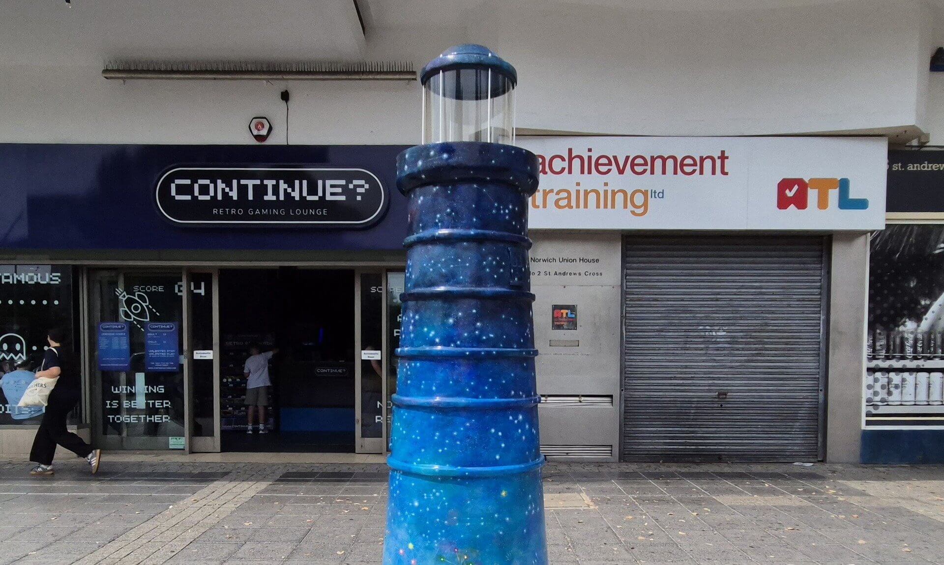Celestial Beacon lighthouse sculpture painted as a starry night sky, on display in Plymouth