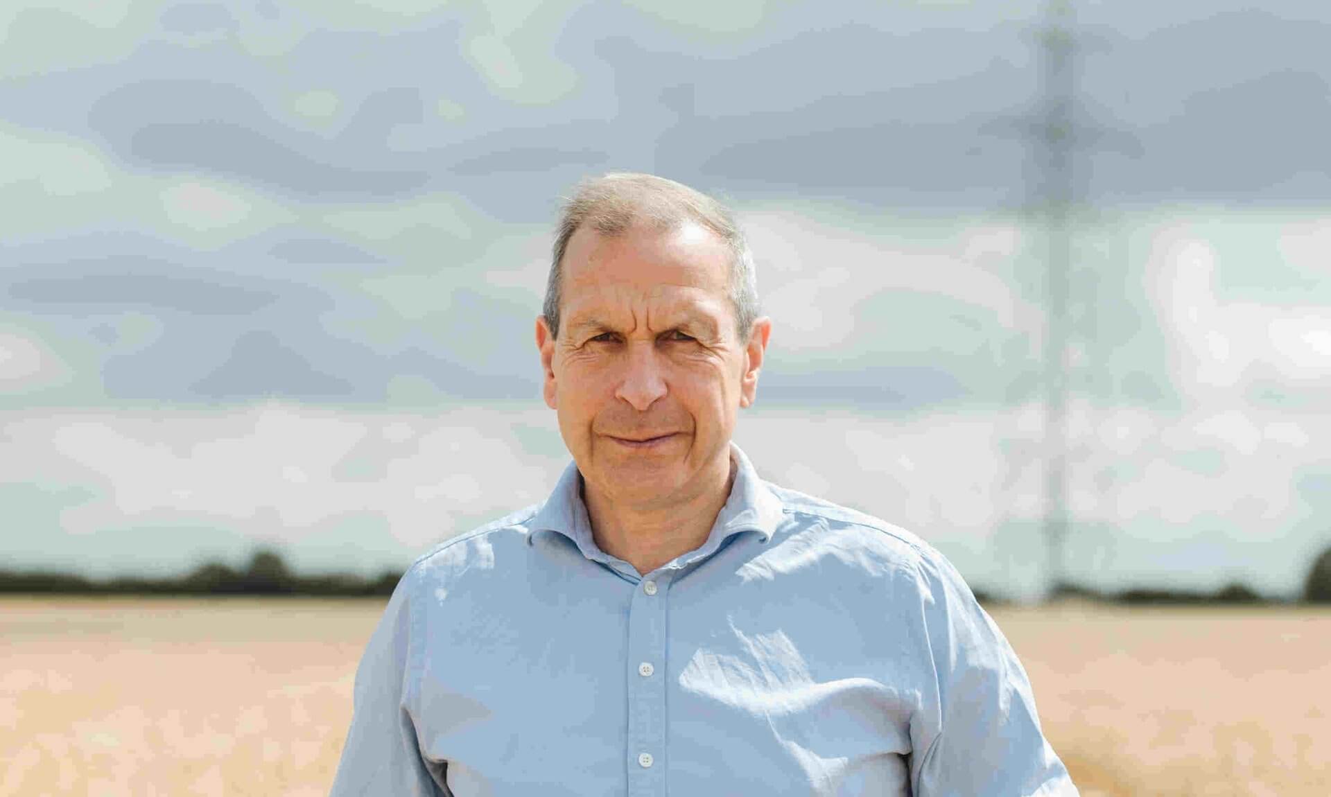 Gavin Lane, President of the Country Land and Business Association, standing in a wheat field