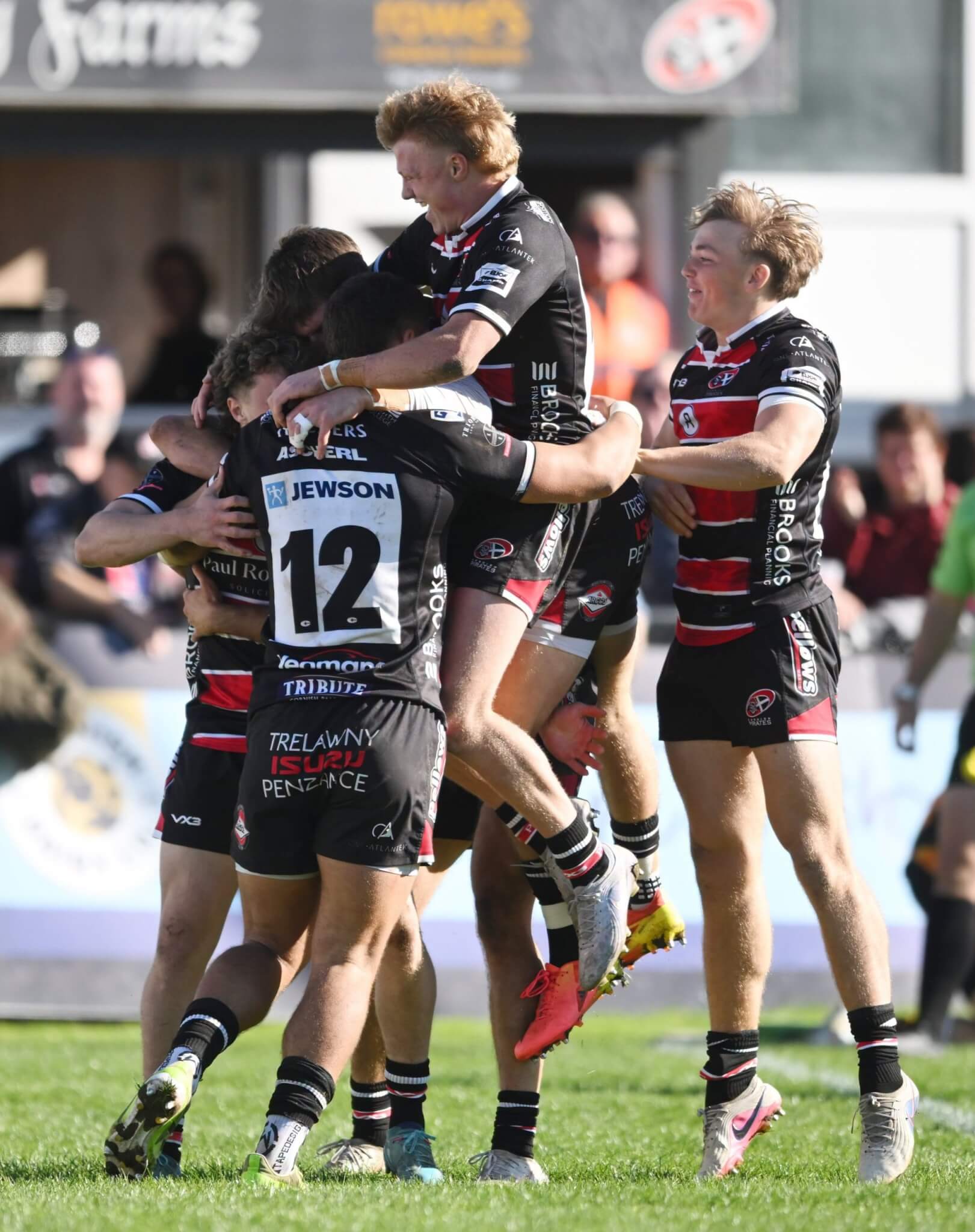 Cornish Pirates players celebrating a try against Chinnor at the Mennaye Field