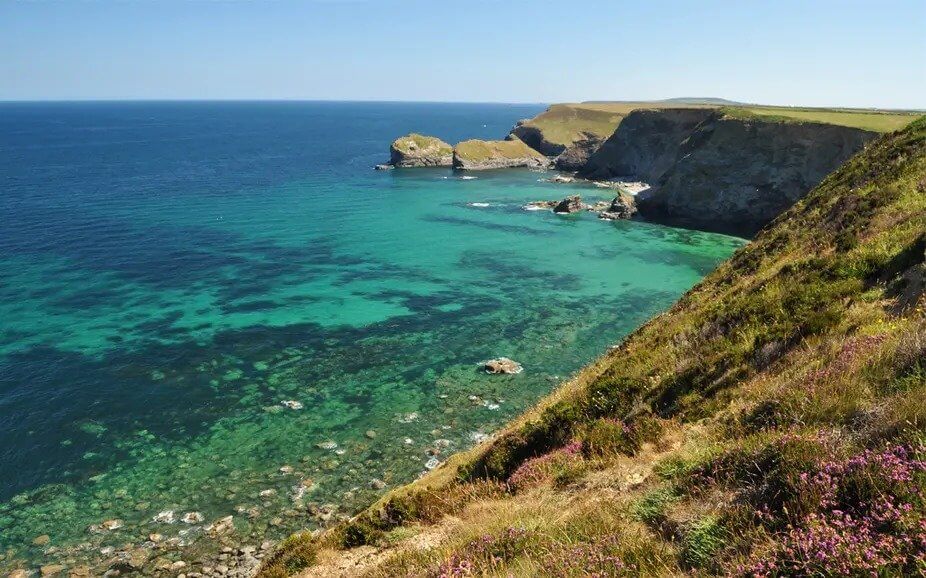 Clear turquoise water below the North Cliffs near Deadman's Cove