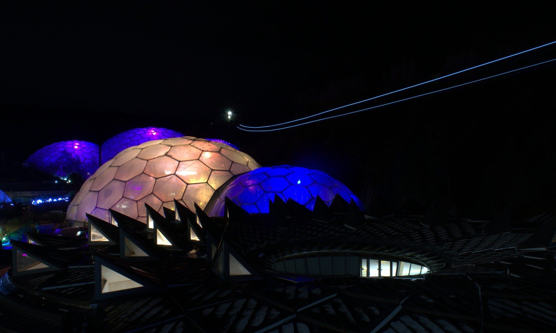 Hangloose Adventure Skywire Night Flight light trail above the illuminated Eden Project biomes