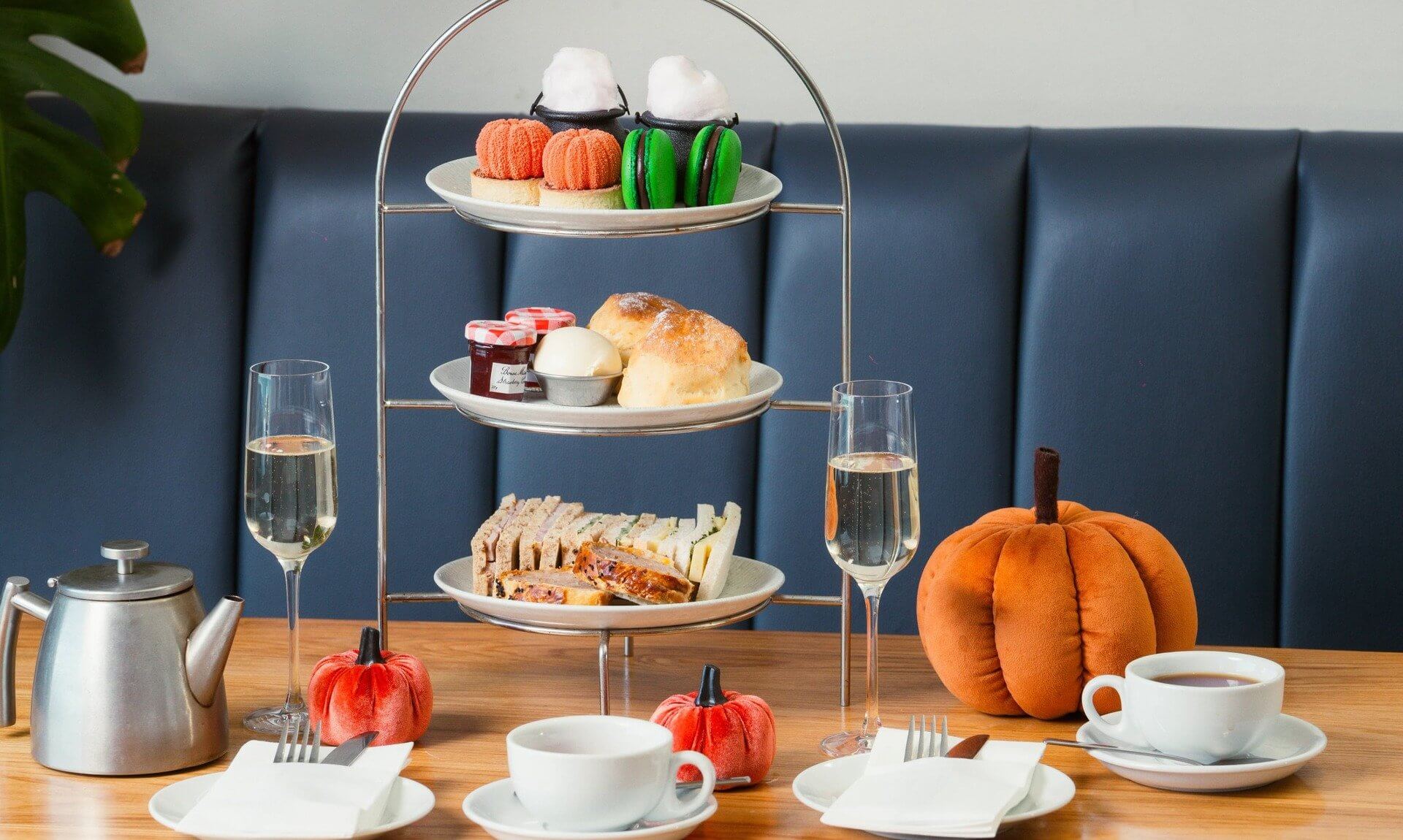 Halloween afternoon tea stand with sparkling wine and a pumpkin at The Esplanade, Newquay