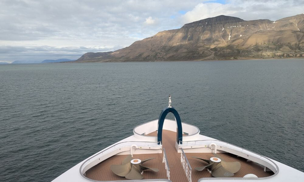 Bow of an expedition ship sailing in Svalbard
