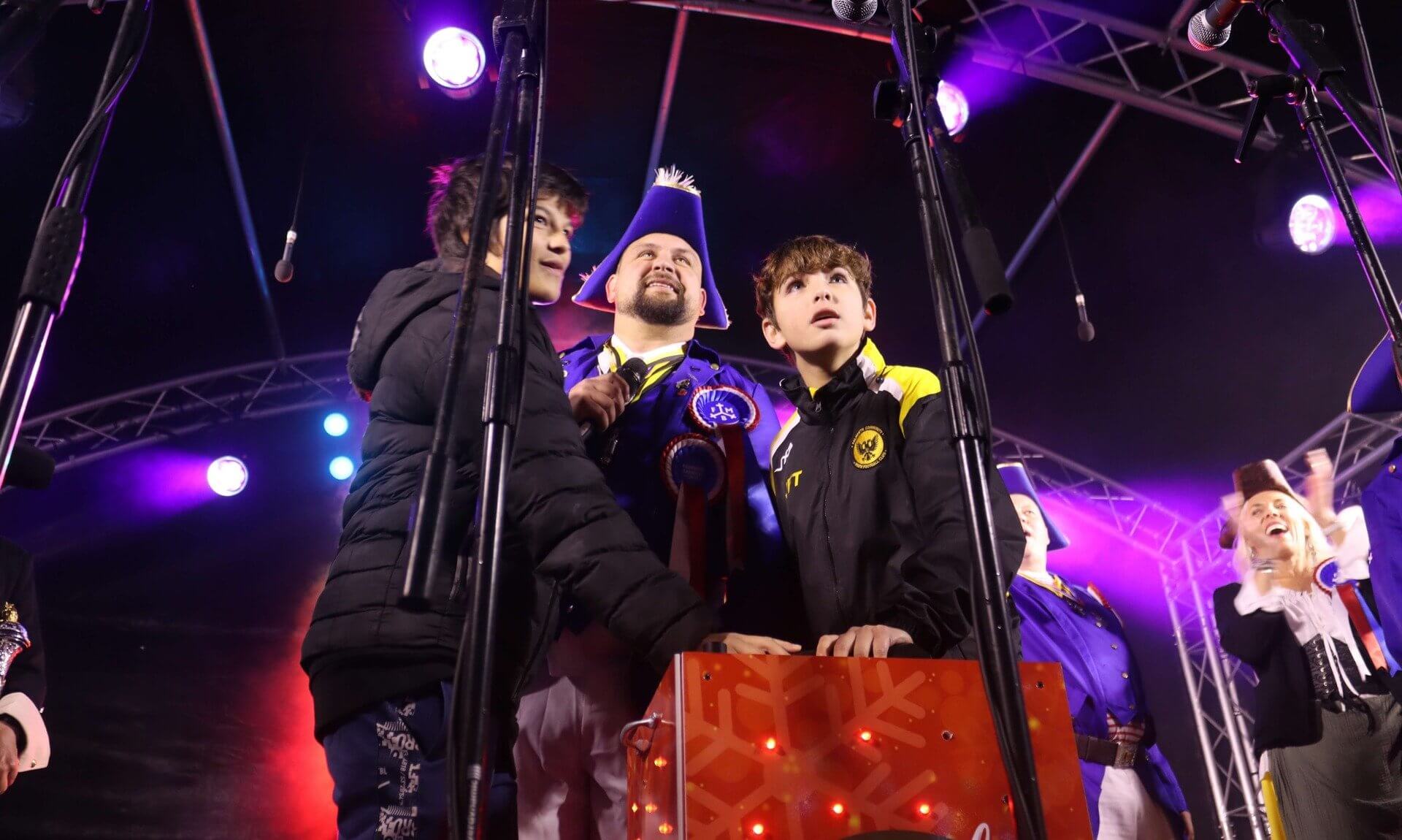 Last year's Falmouth Christmas lights switch-on nominee on stage at the button