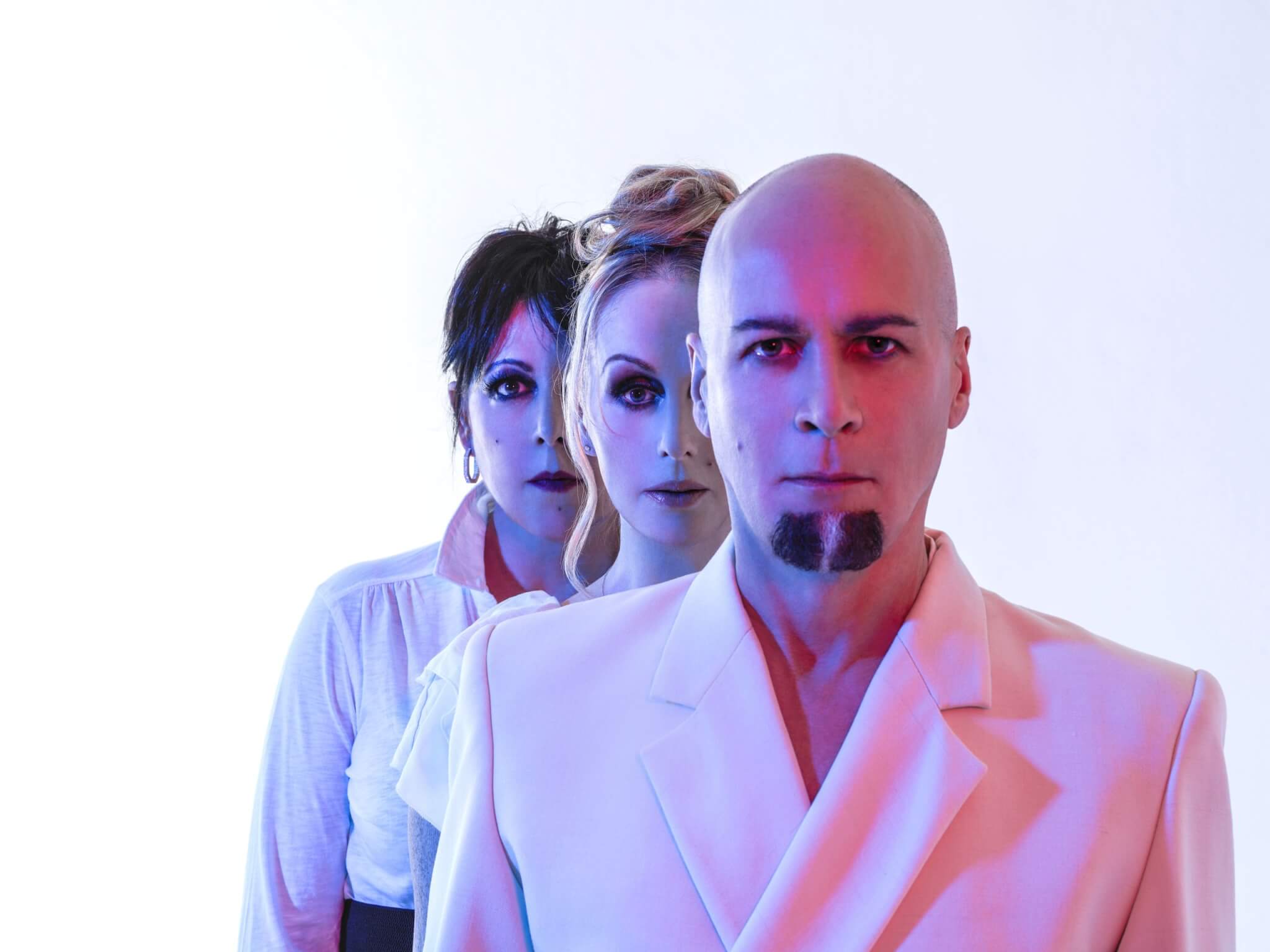 Press image of three people dressed in white, supplied with The Great Estate Festival 2027 announcement