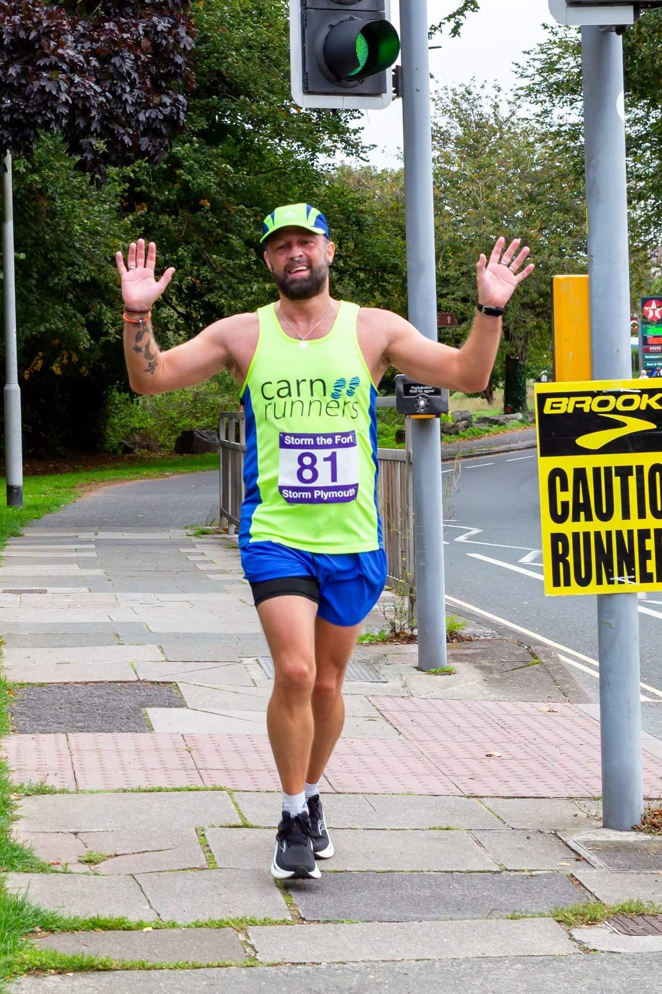 Gavin Pedley running in a Carn Runners vest at Storm the Fort in Plymouth