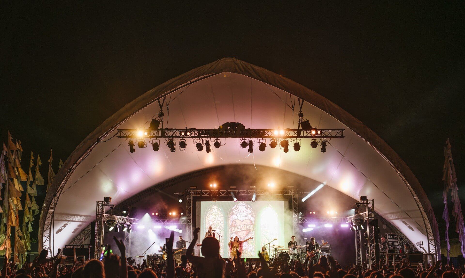 Crowd in front of the main stage at night at The Great Estate Festival, Scorrier