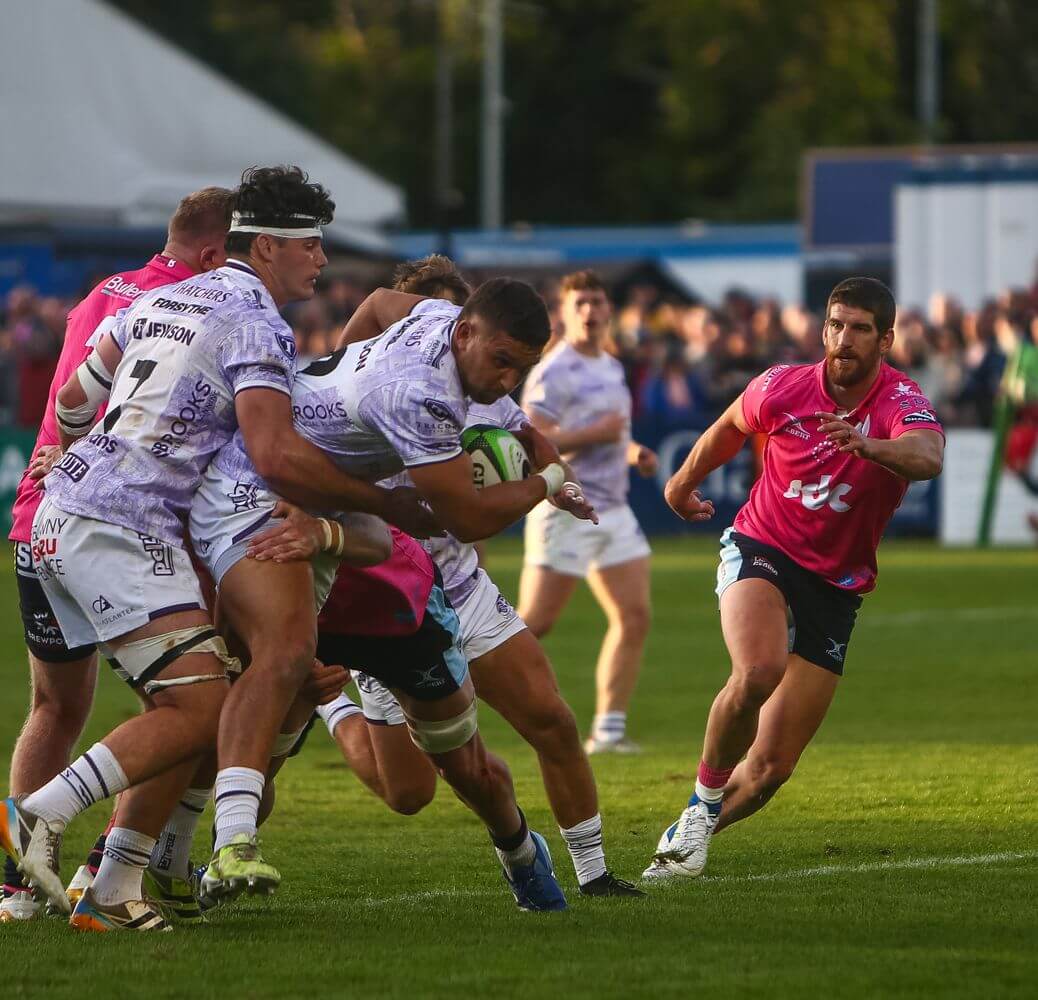 Cornish Pirates centre Harry Ascherl held up by Bedford Blues defenders
