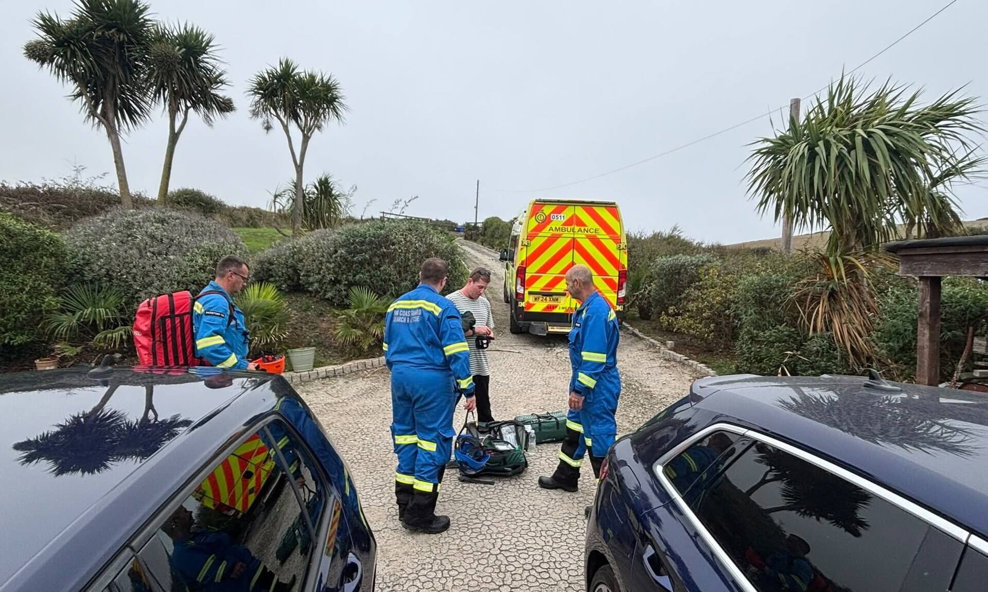 HM Coastguard Padstow team members with a casualty and an ambulance at Hawkers Cove