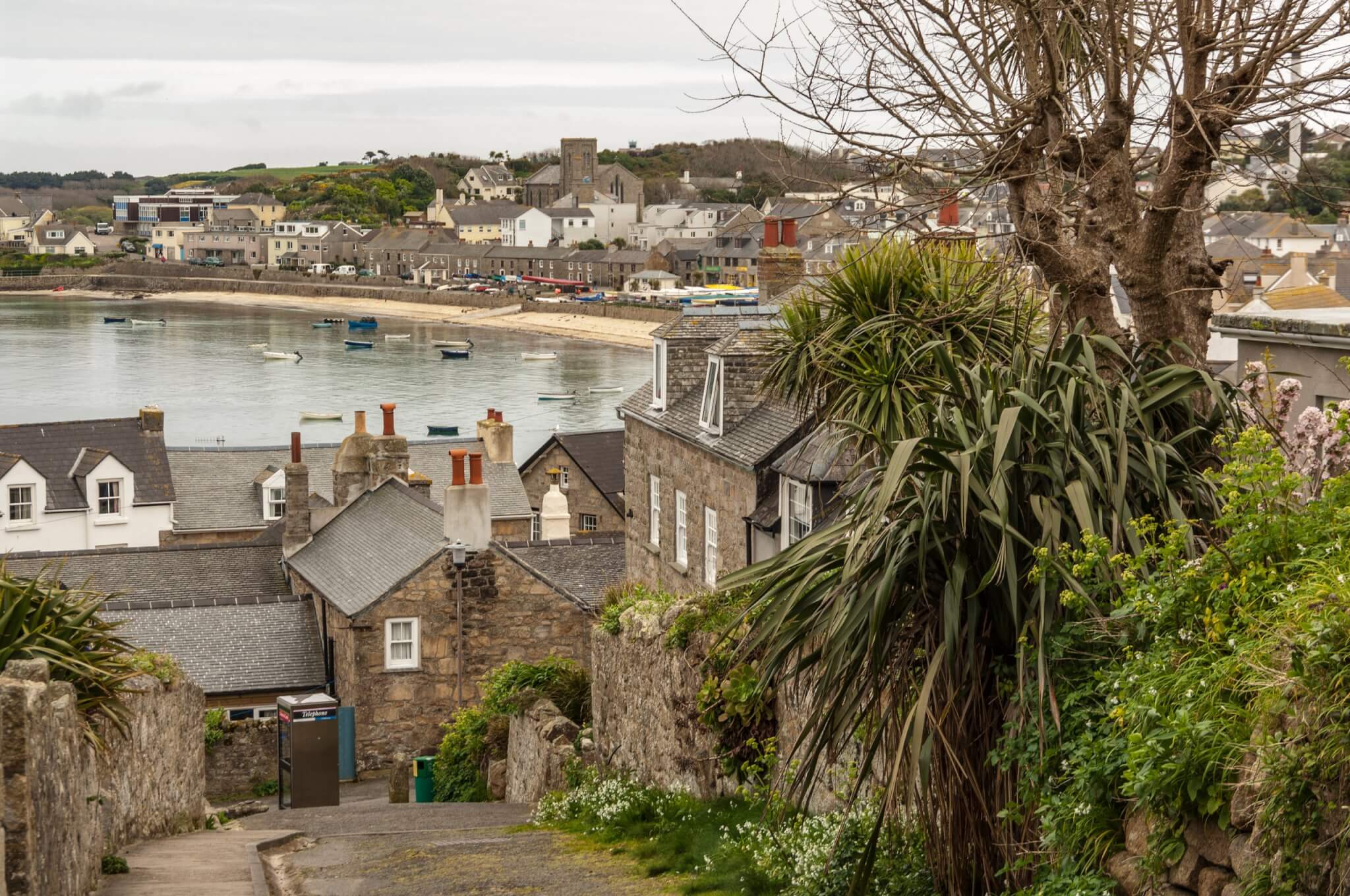 Stone cottages and rooftops above the harbour at Hugh Town, St Mary's, Isles of Scilly