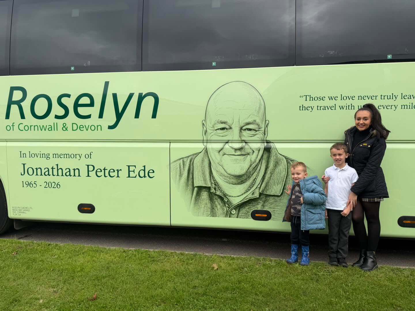 Jonathan Ede's family beside the memorial coach