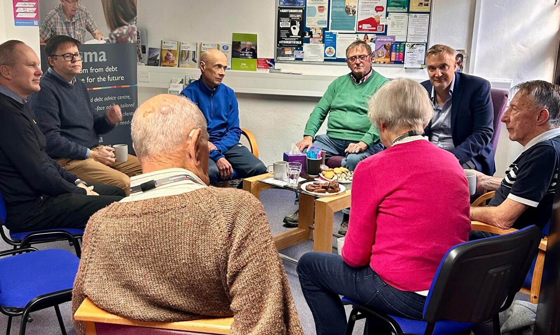 Guests talking in a circle at the CMA Launceston Challenge Poverty Week coffee morning