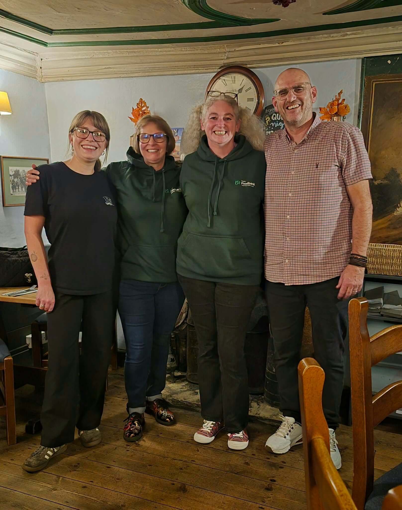 Truro Foodbank volunteers with staff at The Miners Arms, Mithian