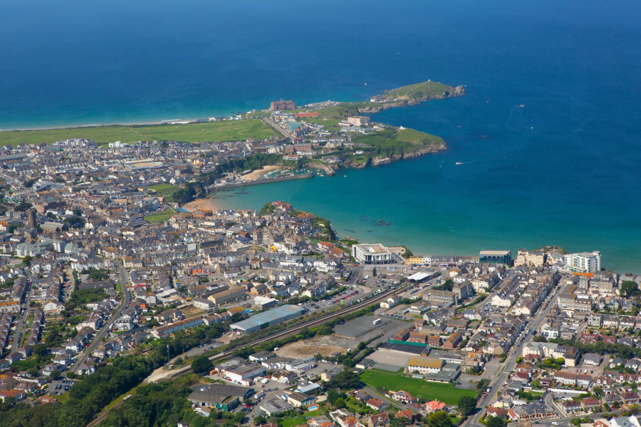 Aerial view of Newquay town, harbour and headland